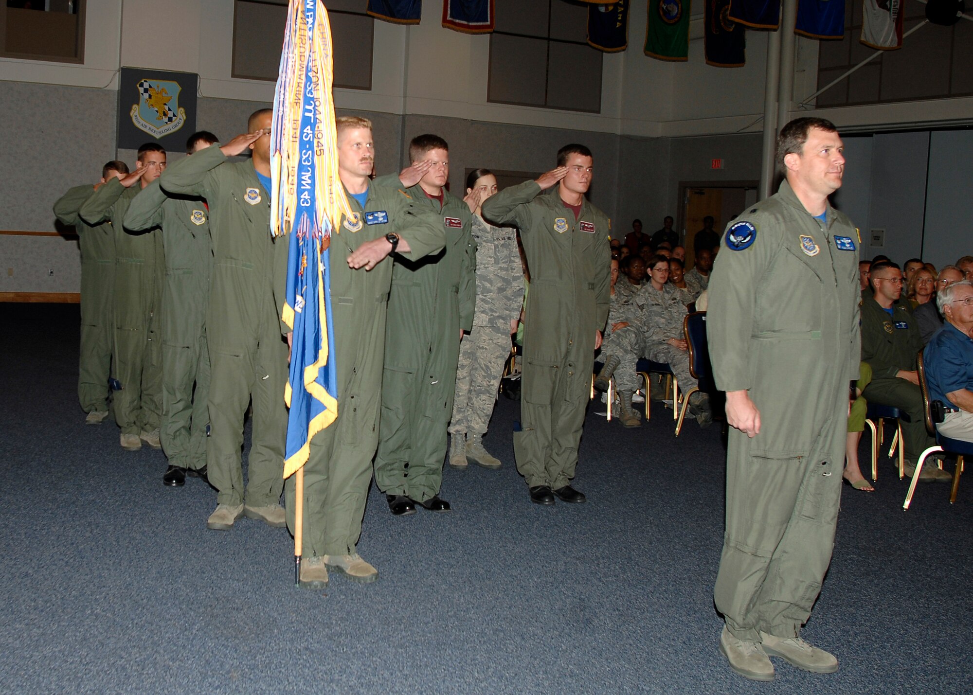 MCCONNELL AIR FORCE BASE, Kan.--Members of the 22d Operations Group render the first salute to their new group commander here at the Robert J. Dole Community Center ballroom, June 5. It is customary that once the gaining commander takes command of the organization, the unit offers the first salute to the new commander. (Photo by Senior Airman Anthony Mejia)