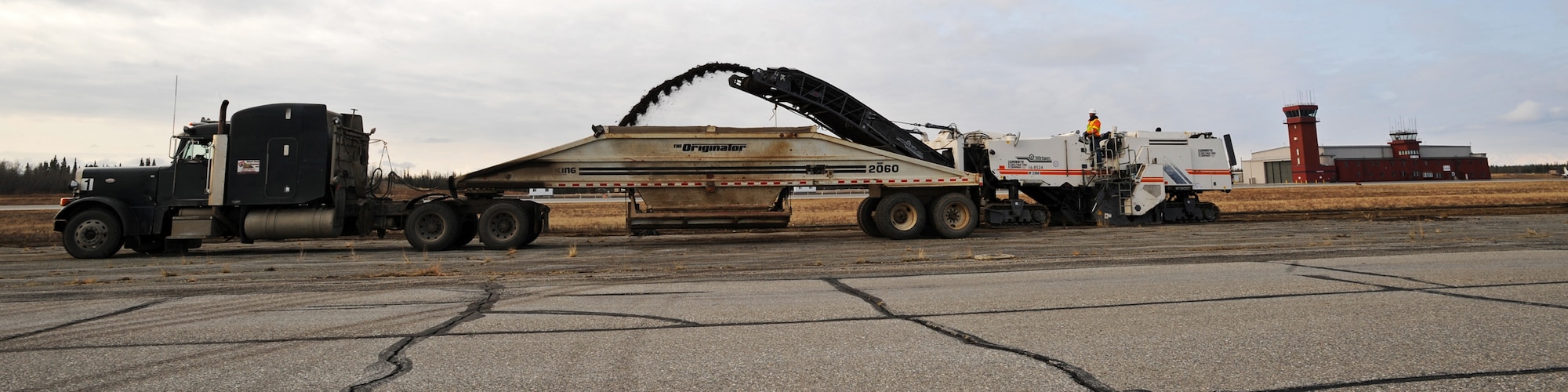 ALLEN ARMY AIRFIELD, Alaska -- Workers move dirt on the Allen Army Airfield airstrip in preparation of building a C-17 assault land strip. The updated assault landing strip will serve the 3rd Wing's C-17 Globemaster IIIs by providing contingency airfield training here. The 517th Airlift Squadron at Elmendorf Air Force Base, Alaska, currently conducts landing certifications at McChord Air Force Base, Wash. (U.S. Air Force photo/Senior Airman Matthew Owens)