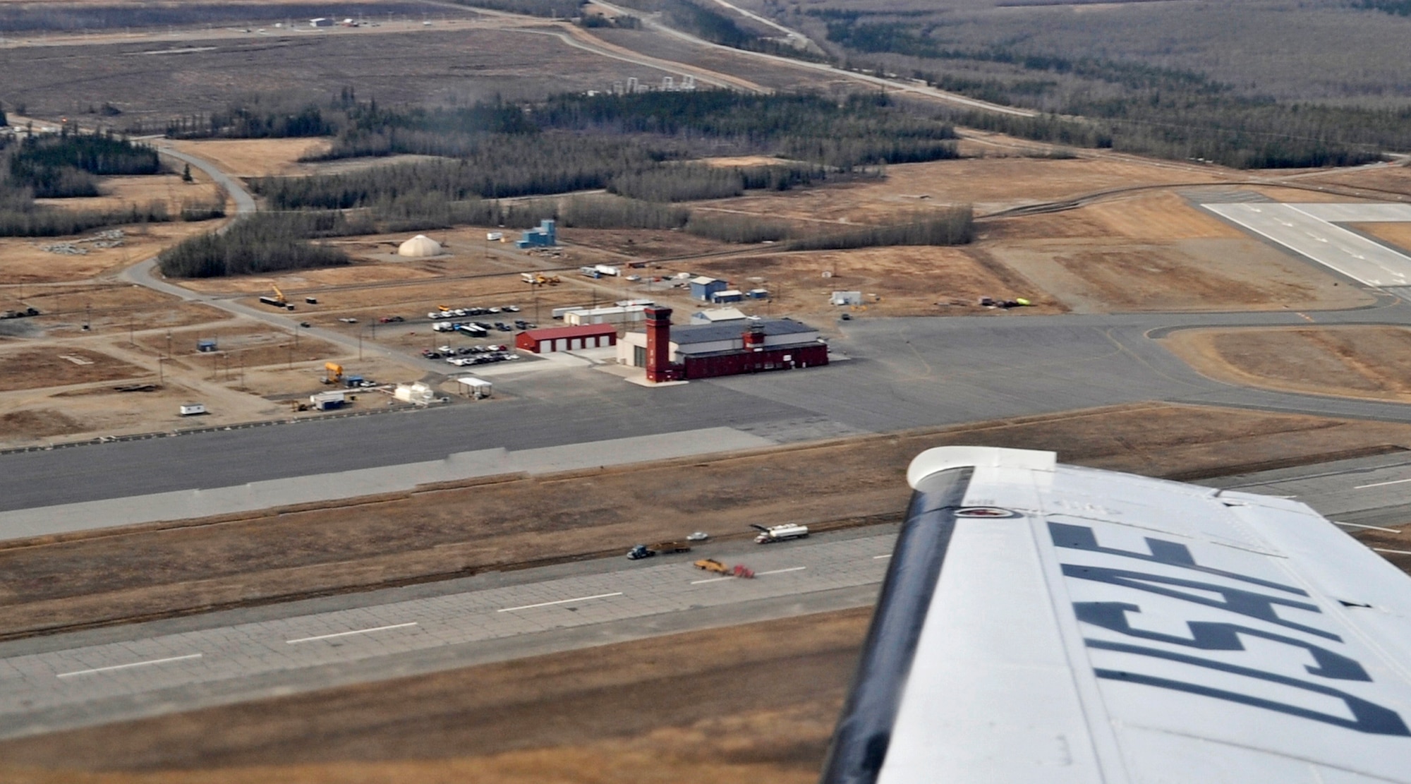 ALLEN ARMY AIRFIELD, Alaska -- The view from a C-12 shows workers doing construction on a new C-17 assault landing strip on Allen Army Airfield. Allen Army Airfield is a public and military airport serving Fort Greely in central Alaska. The airfield is located three miles south of Delta Junction, a city in the Southwest Fairbanks Census Area of Alaska. (U.S. Air Force photo/Senior Airman Matthew Owens)