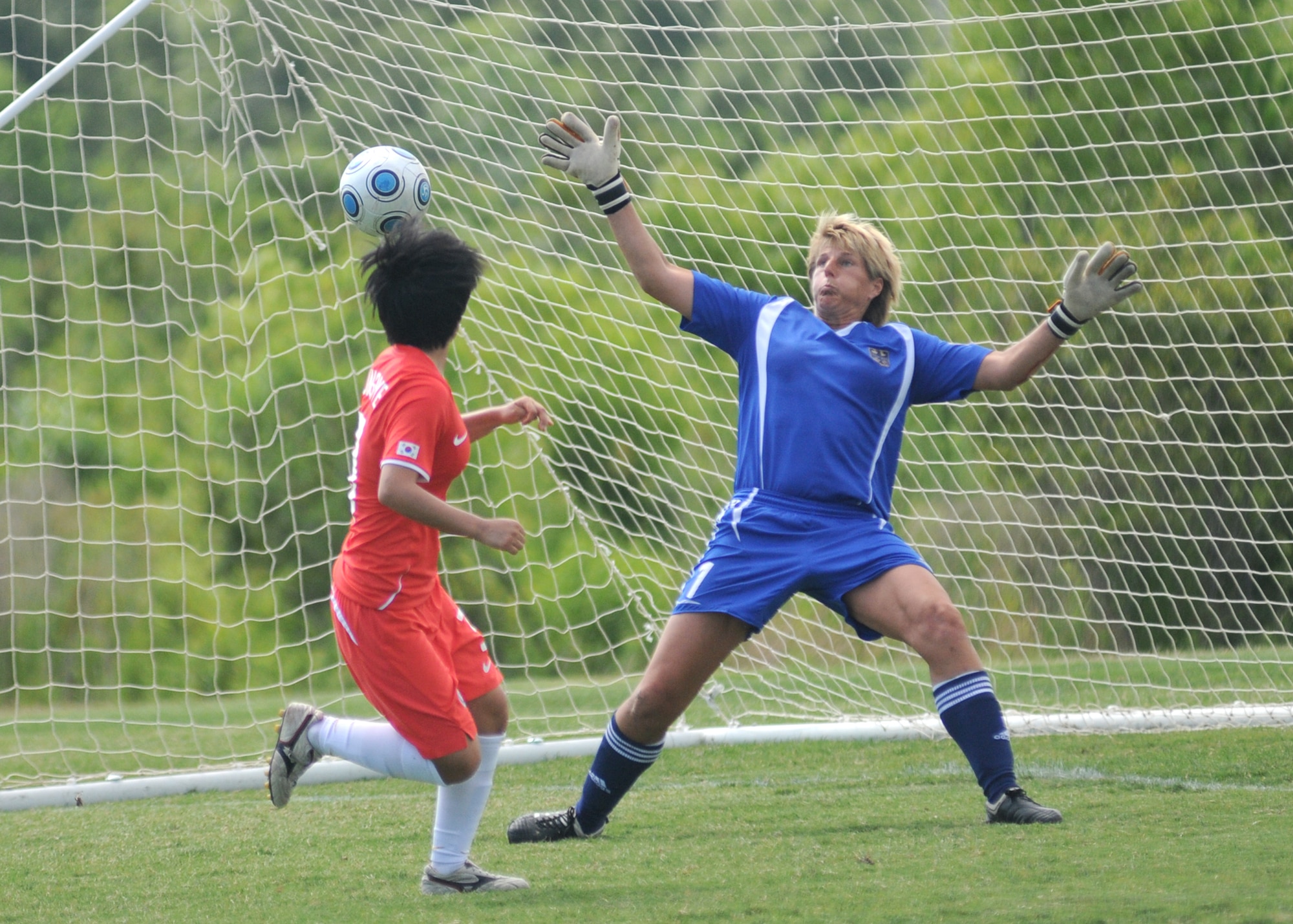Germany and The Republic of South Korea compete during the 5th CISM Women’s Soccer Championship at the Gulfport Sports Complex 9 June.  The CISM tournament, hosted by Keesler Air Force Base, includes teams from Brazil, Canada, France, Germany, The Netherlands, The Republic of South Korea and the United States.  Matches are being held June 6 to 13, with the Gold match June 13 at 2 p.m.  Organizers say the tournament gives teams and people who attend a chance to develop bonds and life-long friendships between the countries and a chance to learn about one another’s cultural similarities and differences.  (U.S. Air Force photo by Kemberly Groue)
