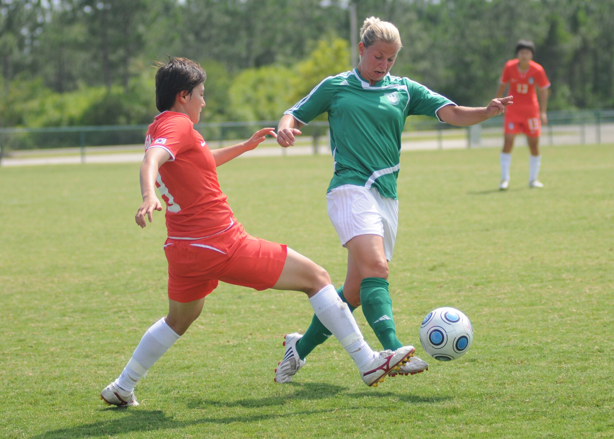 Germany and The Republic of South Korea compete during the 5th CISM Women’s Soccer Championship at the Gulfport Sports Complex 9 June.  The CISM tournament, hosted by Keesler Air Force Base, includes teams from Brazil, Canada, France, Germany, The Netherlands, The Republic of South Korea and the United States.  Matches are being held June 6 to 13, with the Gold match June 13 at 2 p.m.  Organizers say the tournament gives teams and people who attend a chance to develop bonds and life-long friendships between the countries and a chance to learn about one another’s cultural similarities and differences.  (U.S. Air Force photo by Kemberly Groue)