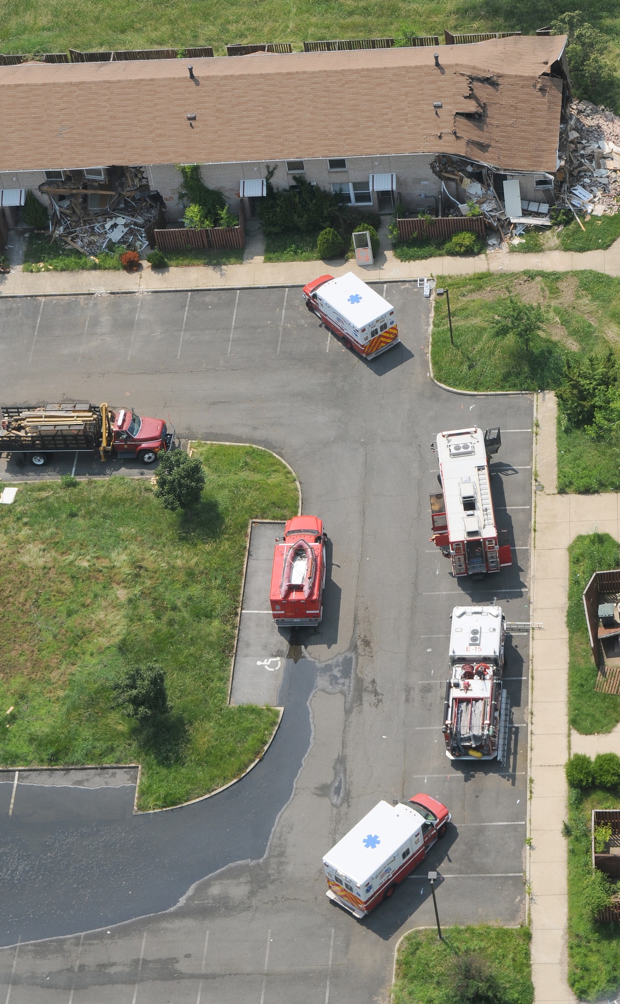 An aerial view of vehicles from Naval District of Washington Fire Department and District of Columbia Fire Department June 8 on Bolling Air Force Base. The NDWFD, in conjunction with the DCFD, conducted exercises June 1 - 12 in a condemned area of base housing that is scheduled for demolition. (U.S. Air Force photo by Senior Airman Alexandre Montes)