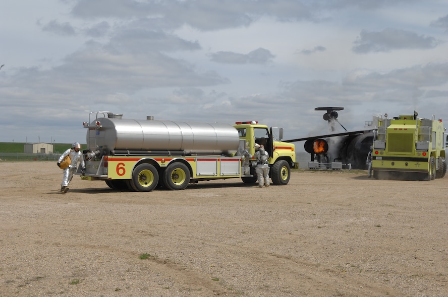 MINOT AIR FORCE BASE, ND – Members from the 5th Civil Engineer Squadron, responded to the scene of an aircraft accident during a major accident response exercise (MARE) here, June 5.  The exercise was held to further strengthen the base’s ability to respond to an aerial accident, in preparation for the upcoming air show and open house, Northern Neighbors Day, scheduled for July 18 here.  (U.S. Air Force photo by Staff Sgt. Angel Gallardo)
