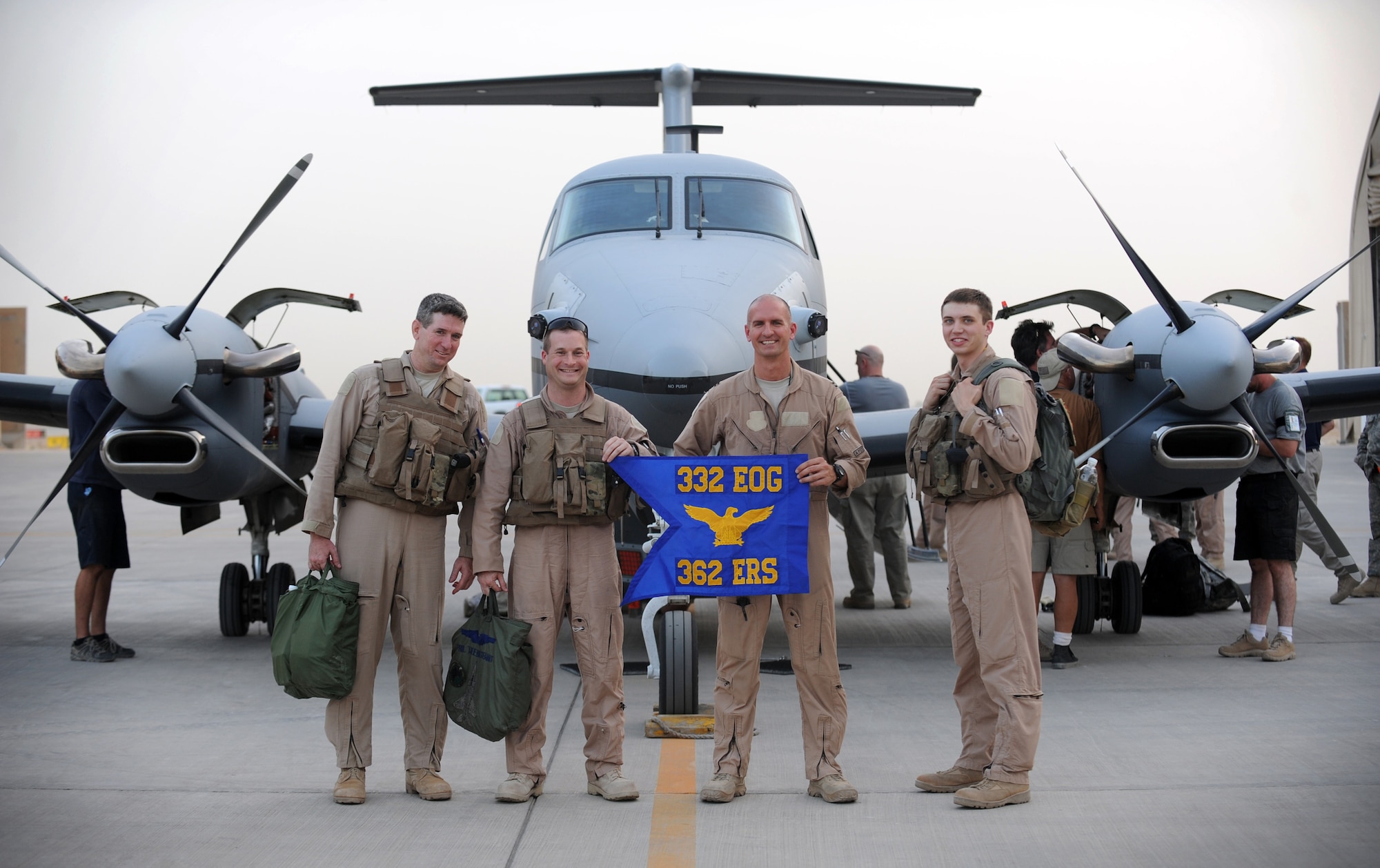 JOINT BASE BALAD, Iraq — From left to right, Senior Master Sgt. Bruce Hunter, Lt. Col. Phillip Stewart, Capt. Jason Goodale and Staff Sgt. Shaun Nelson, all from the 362nd Expeditionary Reconnaissance Squadron, pose in front of an MC-12 Liberty aircraft here at approximately 6:45 p.m. local time June 10 after the aircraft's first combat sortie. The Air Force's newest ISR platform, the MC-12 provides real-time intelligence, surveillance and reconnaissance capability in direct support of Coalition and joint ground forces. Sergeant Hunter is deployed here from Tinker Air Force Base, Okla., and is from Lenox, S.D., Colonel Stewart is deployed here from Langley Air Force Base, Va., and is a native of Silver Spring, Md. Captain Goodale is deployed here from Travis Air Force Base, Calif., and is from Sioux Falls, S.D. Sergeant Nelson is deployed here from Offutt Air Force Base, Neb., and is a native of Rock Springs, Wyo. (U.S. Air Force photo/Senior Airman Elizabeth Rissmiller)