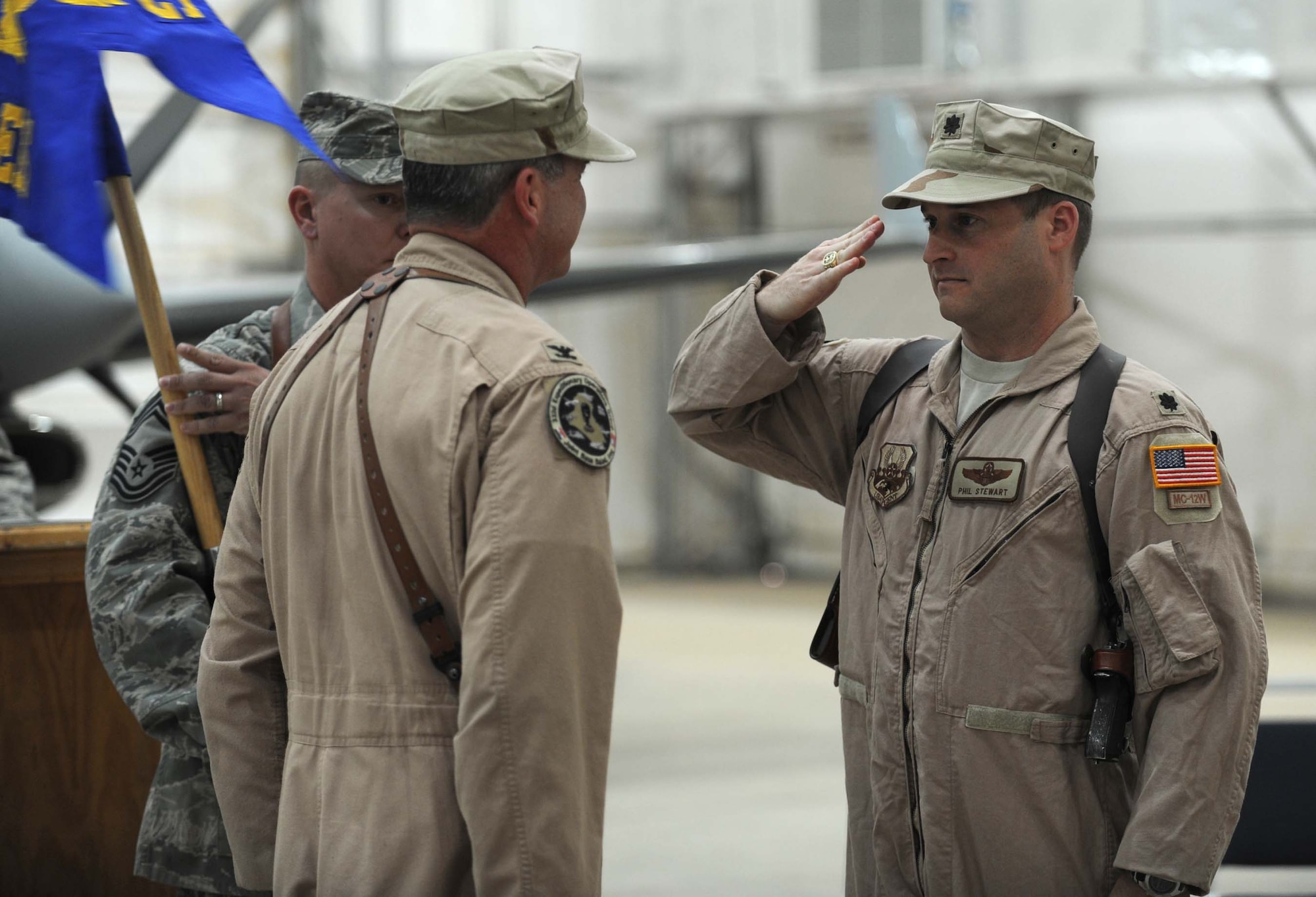 JOINT BASE BALAD, Iraq — Lt. Col. Phillip Stewart, 362nd Expeditionary Reconnaissance Squadron commander, salutes Col. Michael Fantini, 332nd Expeditionary Operations Group commander, upon assuming command of the 362nd ERS here June 9. The squadron was activated to conduct MC-12 operations. The MC-12 is a medium-altitude manned special-mission turboprop aircraft designed for intelligence, surveillance and reconnaissance. Colonel Stewart is deployed here from Langley Air Force Base, Va., and is a native of Silver Spring, Md. Colonel Fantini is deployed here from Headquarters Air Force, the Pentagon, and is a native of Annandale, Va. (U.S. Air Force photo/Senior Airman Elizabeth Rissmiller)