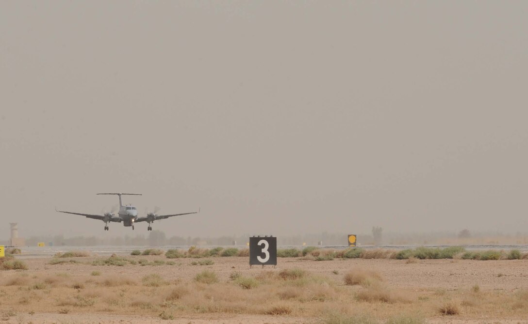 JOINT BASE BALAD, Iraq — The Air Force's new MC-12 Liberty aircraft, and the first one deployed in-theater, lands here June 8. A medium-altitude manned special-mission turboprop aircraft designed for intelligence, surveillance and reconnaissance, MC-12 aircraft will operate from here in support of Coalition and joint ground forces. (U.S. Air Force photo/Senior Airman Elizabeth Rissmiller)