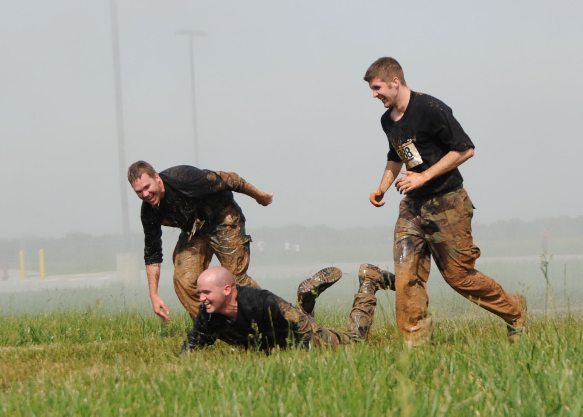 SCOTT AIR FORCE BASE, Ill. -- A runner falls onto the wet ground Saturday near the end of the race. (U.S. Air Force photo/ Tech. Sgt. Michelle Larche)