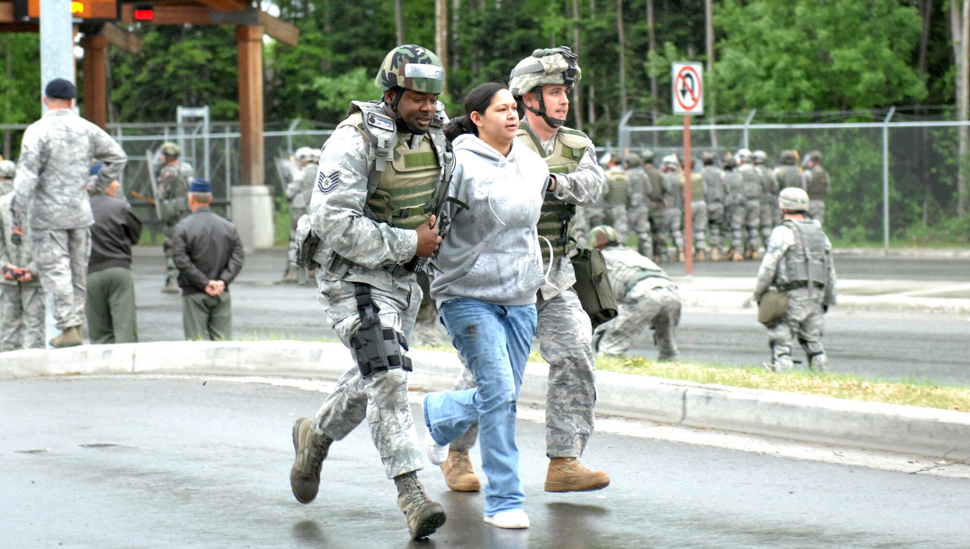 ELMENDORF AIR FORCE BASE, Alaska -- Members of the 3rd Security Forces Squadron secure demonstrators who breached the Boniface Gate during an Operational Readiness Inspection June 4. This portion of the inspection was a part of the second phase, which tested the 3rd Wing's ability to survive and operate in a combat environment. (U.S. Air Force photo/Tech. Sgt. Brian Smith)