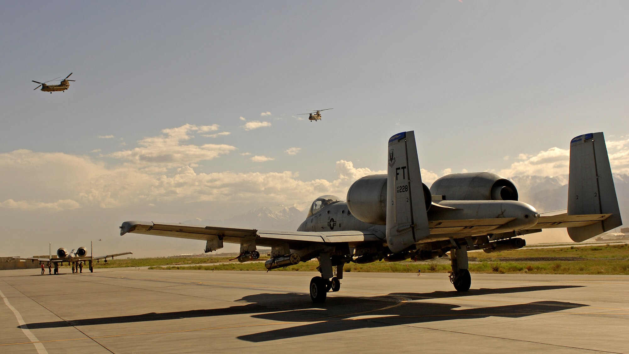 BAGRAM AIR FIELD, Afghanistan - A pair of A-10 Thunderbolt IIs from the 74th Expeditionary Fighter Squadron get their final weapons check before taking off on a close air support mission June 9. Last month the 74th EFS and 336th Expeditionary Fighter Squadron together logged a total of more than 5,000 combat flight hours over Afghanistan. The F-15s and A-10s assigned here provide close air support and airborne intelligence, surveillance and reconnaissance for American and coalition ground troops. (Air Force/Staff Sgt. Jason Lake)