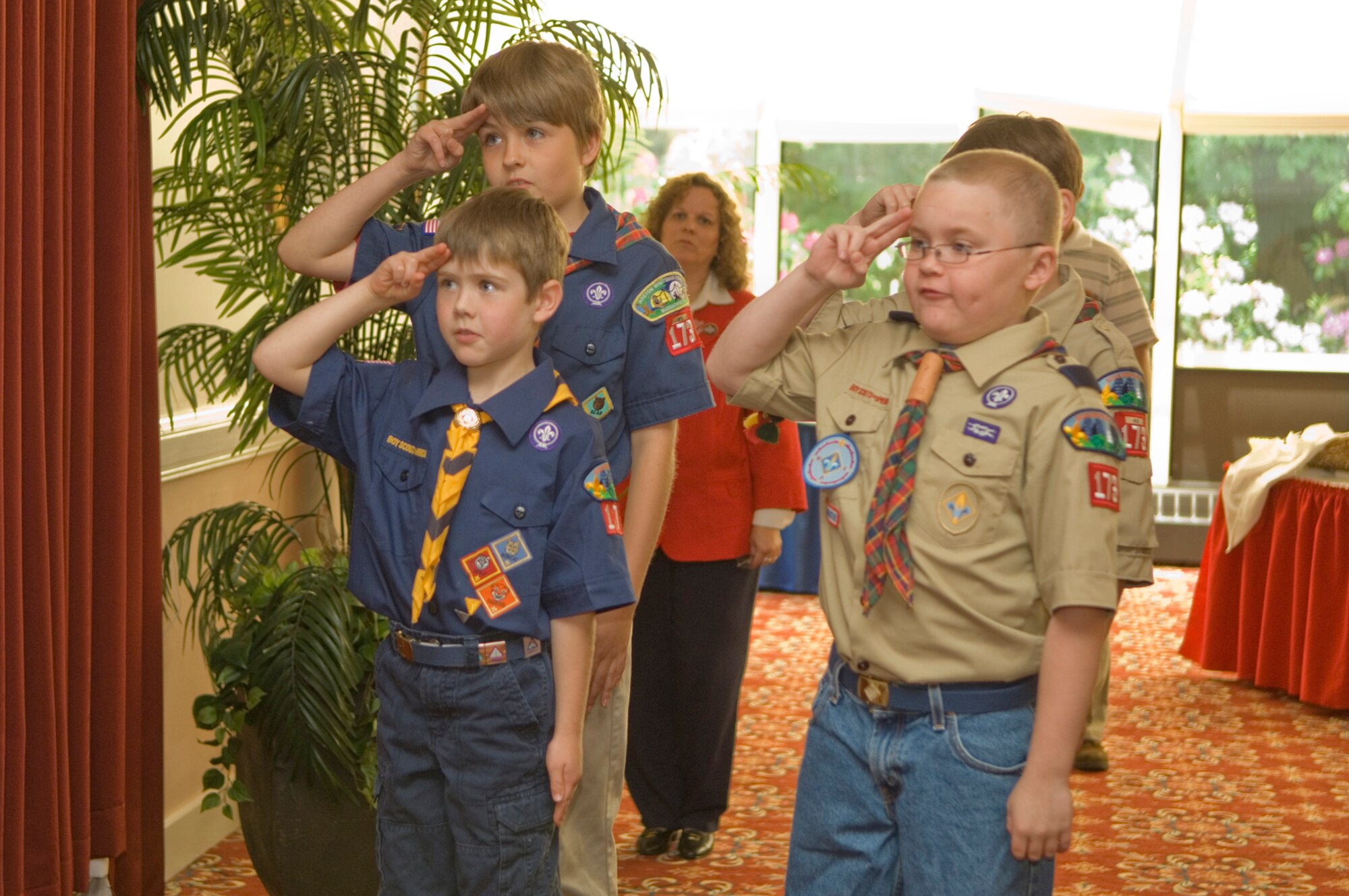HANSCOM AIR FORCE BASE, Mass. –Members of Scout Pack 173, salute the flag after posting the colors at the Volunteer Salute recognition ceremony at the Minuteman Club on June 4. The ceremony recognized and honored the contributions of Hanscom’s volunteers. (U.S. Air Force photo by Mark Wyatt) 