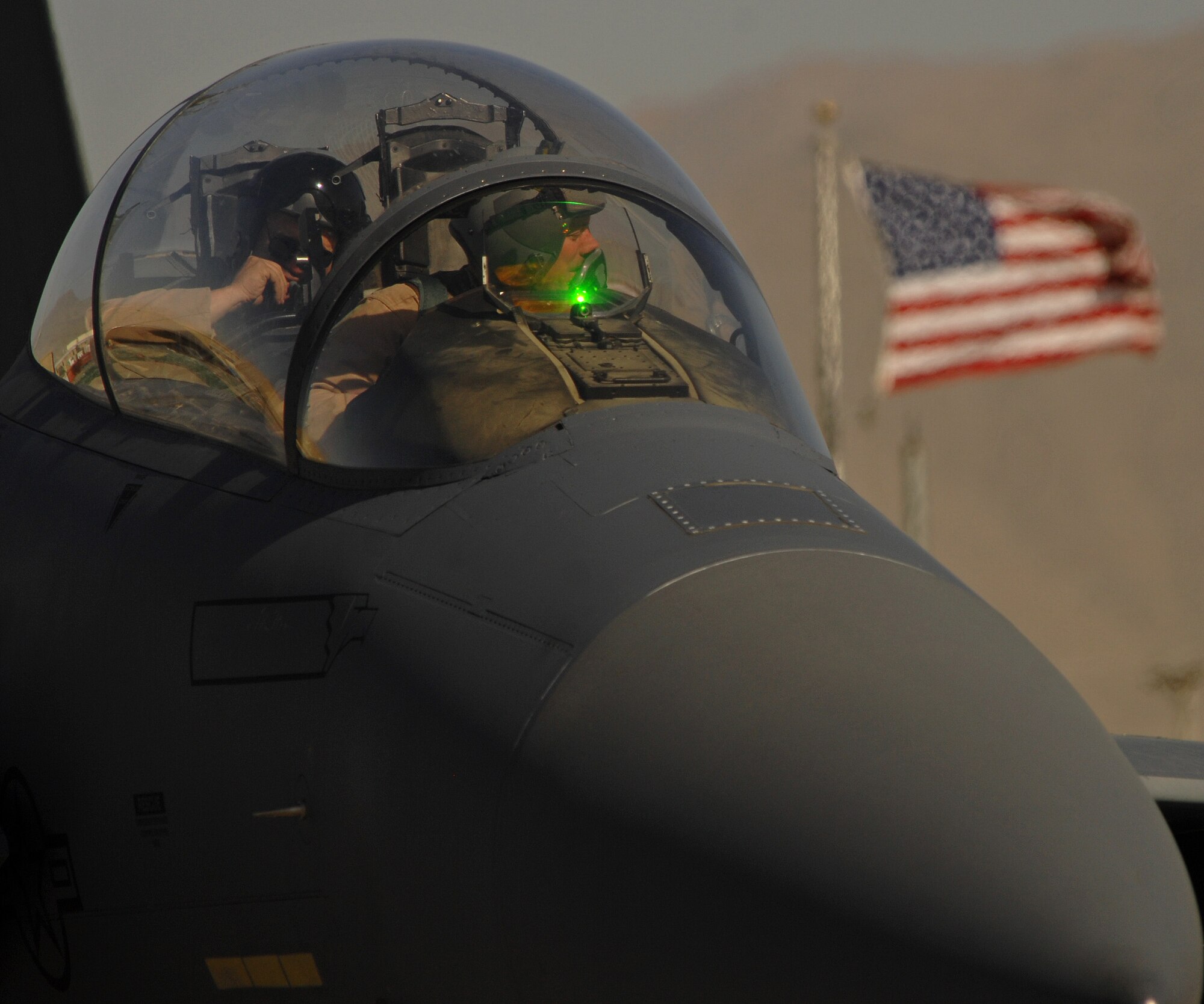 BAGRAM AIR FIELD, Afghanistan -- An F-15 pilot and weapon system operator from the 336th Expeditionary Fighter Squadron prepare to take off for a close air support mission June 9. Last month the 336th EFS and 74th Expeditionary Fighter Squadron  together logged a total of more than 5,000 combat flight hours over Afghanistan. The F-15s and A-10s assigned here provide close air support and airborne intelligence, surveillance and reconnaissance for American and coalition ground troops. (Air Force/Staff Sgt. Jason Lake)
