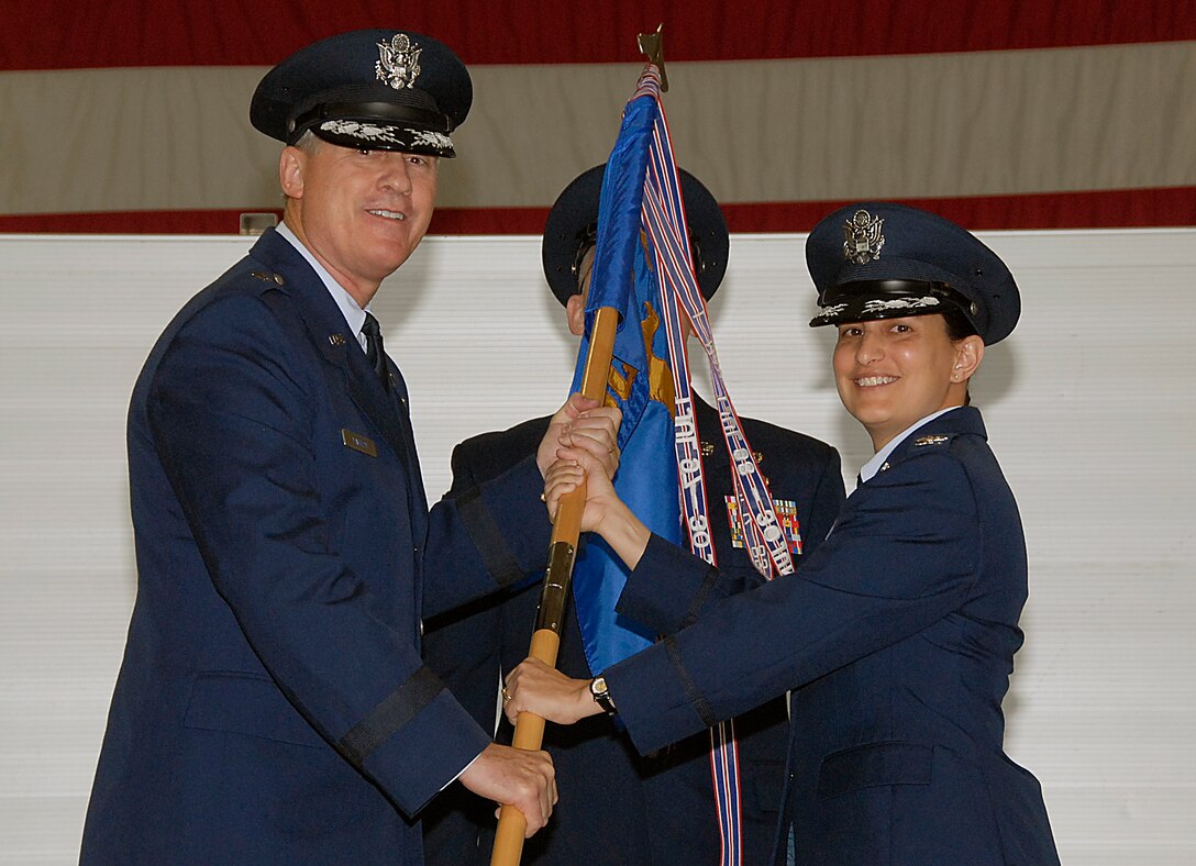 Brig. Gen. O.G. Mannon, 82nd Training Wing commander, passes off the guidon of the 82nd Mission Support Group to its new commander, Col. Kimberley Ramos June 8. Colonel Ramos replaced Col. Richard Lipsey.(U.S. Air Force photo/ Harry Tonemah)
