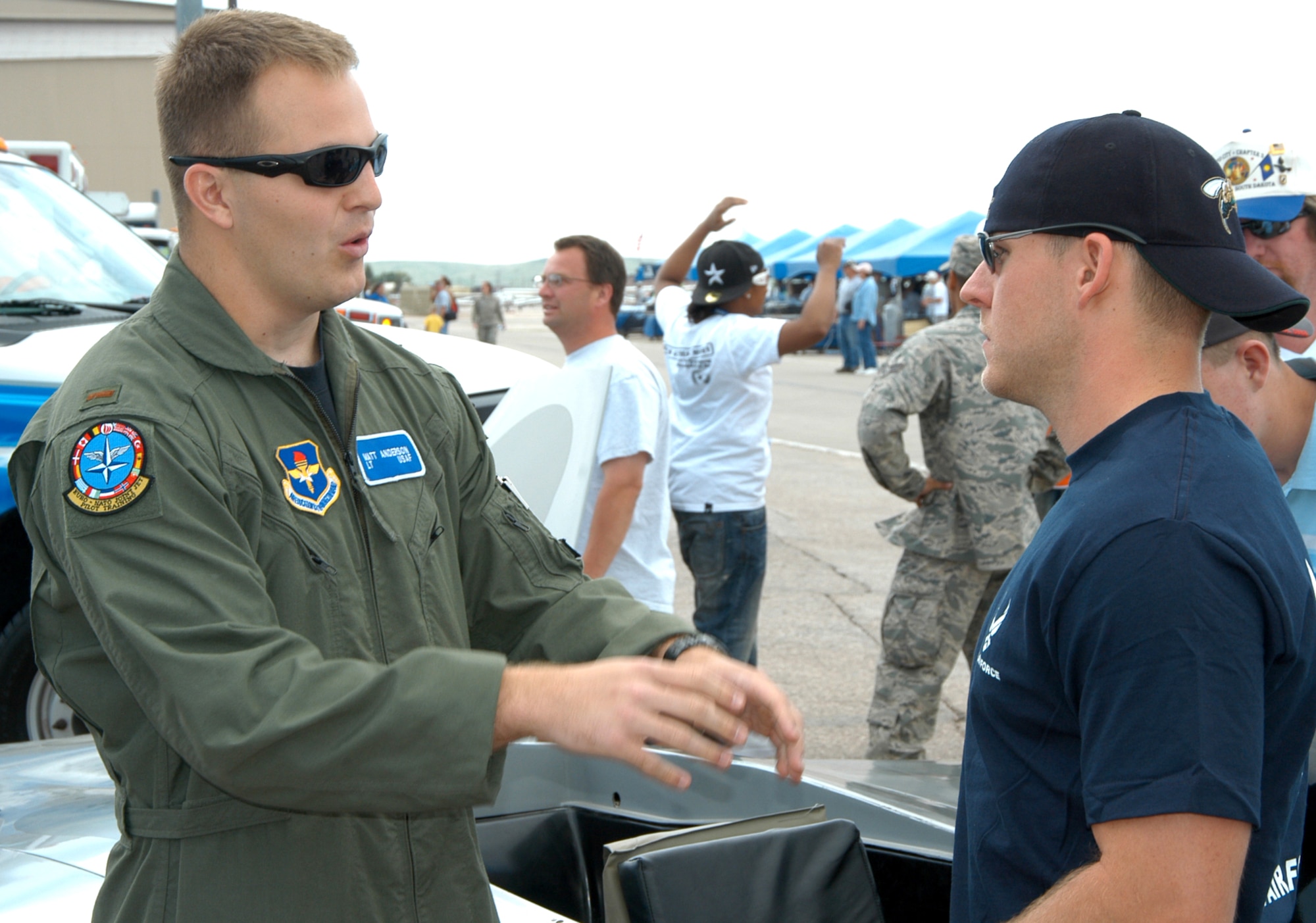 Second Lt. Matt Anderson talks to William Fundit, who was selected to attend Officer Training School, during the recent Dakota Thunder 2009 Open House and Air Show at Ellsworth Air Force Base, S.D. Lieutenant Anderson is a student pilot assigned to Sheppard Air Force Base, Texas. (U.S. Air Force photo/Tech. Sgt. David J. McCarrison)