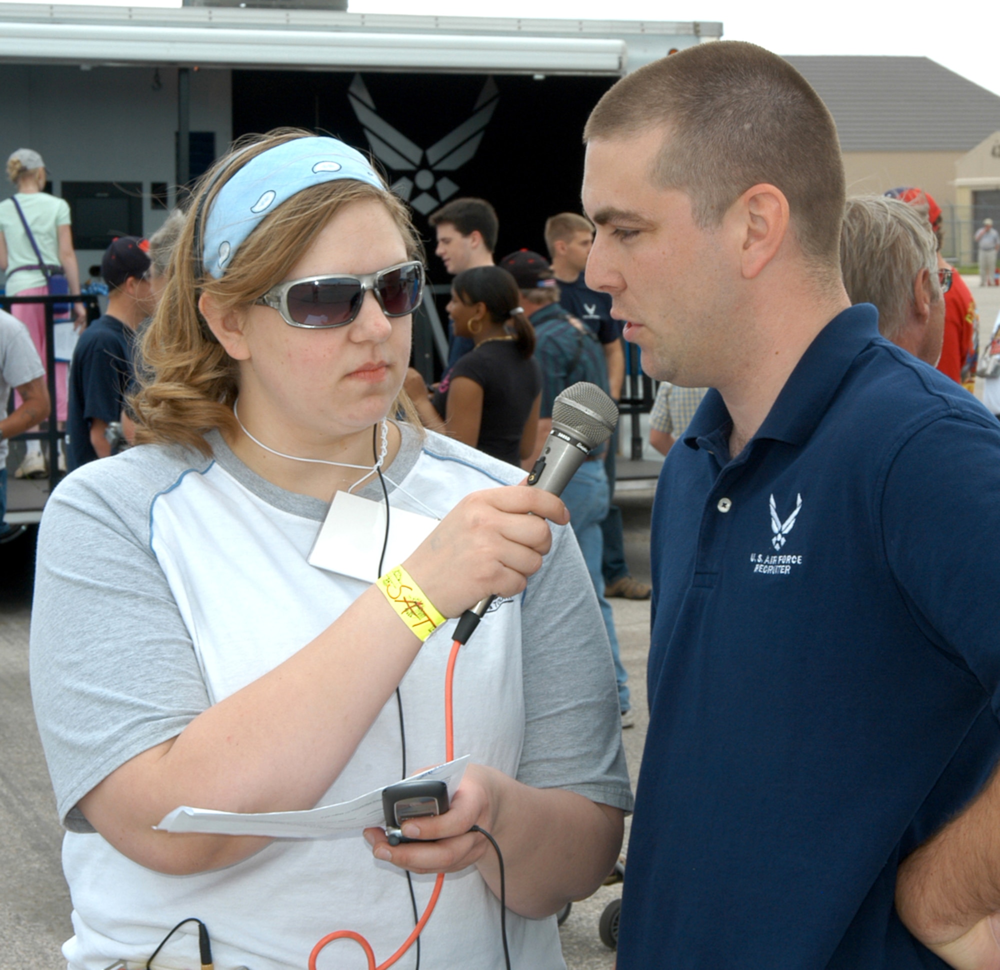 Staff Sgt. Cory Wasinger is interviewed by a local radio station about Air Force careers and benefits during the recent Dakota Thunder 2009 Open House and Air Show at Ellsworth Air Force Base, S.D. Members of the 343rd Recruiting Squadron supported the air show with recruiting displays and spoke with attendees about Air Force opportunities. More than 40,000 attended the open house and air show to see the U.S. military's air power firsthand and speak with servicemembers about what they do and why they serve. Sergeant Wasinger is an enlisted accessions recruiter in Rapid City, S.D., assigned to the 343rd RCS. (U.S. Air Force photo/Tech. Sgt. David J. McCarrison)