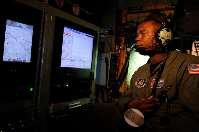 Tech. Sgt. Troy Bickham checks weather data on a training mission recently to St. Croix, V.I., on a WC-130J Hercules from Keesler Air Force Base, Miss. Sergeant Bickham is a weather reconnaissance loadmaster assigned to the Hurricane Hunters of the 53rd Weather Reconnaissance Squadron.  (U.S. Air Force photo/Staff Sgt. Desiree N. Palacios)