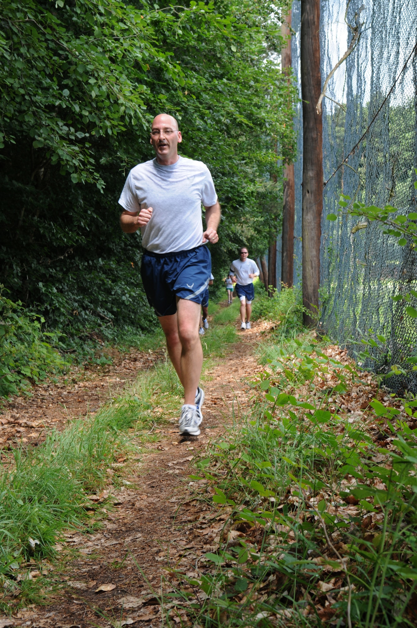 Chief Master Sgt. Mitchell Stippel, 435th Air Base Wing command chief, finishes up running on the newly finished 10 kilometer trail, Ramstein Air Base, Germany, June 9, 2009. (U.S. Air Force photo by Staff Sgt. Levi Riendeau)