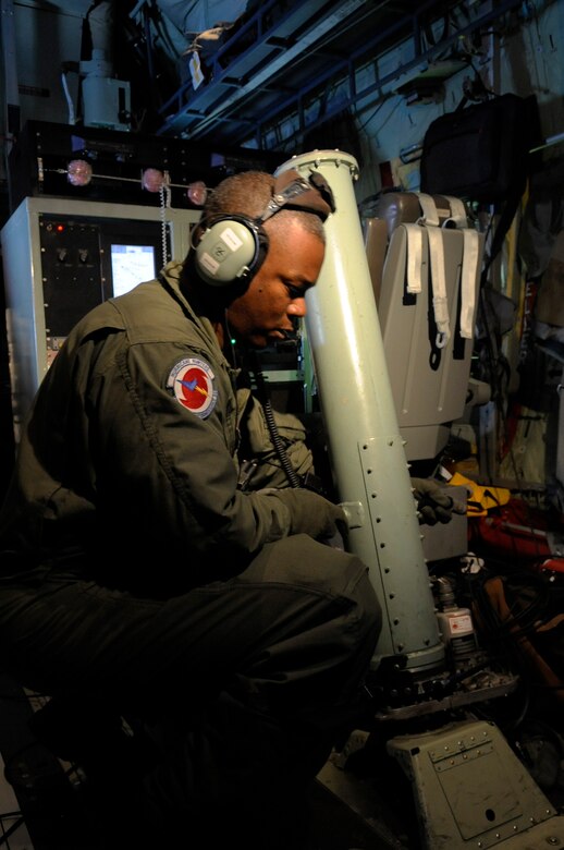 Tech. Sgt. Troy Bickham loads a dropsonde in the  launch chute on a training mission June 6 to St. Croix, V.I. on a WC-130J  Hercules from Keesler Air Force Base, Miss. Sergeant Bickham is a weather reconnaissance loadmaster assigned to the 53rd Weather Reconnaissance Squadron.  The training mission prepared the Air Force Reserve Command's "Hurricane Hunters" as they enter Hurricane Season, which began June 1. (U.S. Air Force photo/Staff Sgt. Desiree N. Palacios)