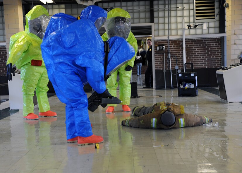 MINOT AIR FORCE BASE, ND – Members of the Army National Guard 81st Civil Support Team check for chemical and radioactive exposure of a “patient” during a recent, joint anti-terrorism exercise held at the Minot Water Treatment Facility, June 3. The exercise involved several agencies, including the base, Bismarck Army National Guard, Minot Fire and Rescue Service, and the Minot Police Department. The purpose of this exercise was to ensure vigilance and readiness in order to defeat possible terrorist threats wherever they may occur. (US Air Force photo by Staff Sgt. Keith Ballard)