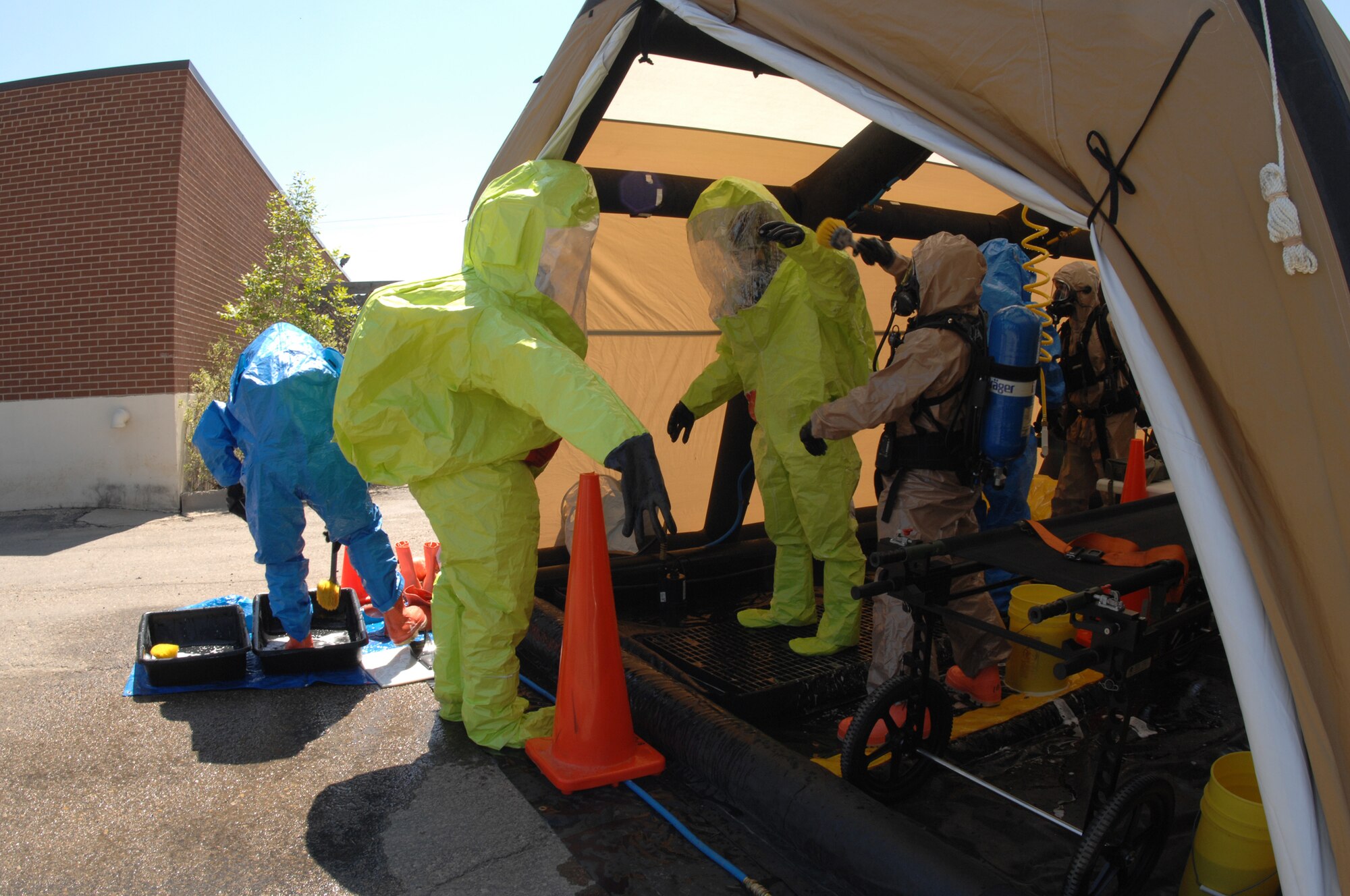 MINOT AIR FORCE BASE, ND – Members of the Army National Guard 81st Civil Support Team go through the decontamination tent during a recent, joint anti-terrorism exercise held at the Minot Water Treatment Facility, June 3. The exercise involved several agencies, including the base, Bismarck Army National Guard, Minot Fire and Rescue Service, and the Minot Police Department.  The purpose of this exercise was to ensure vigilance and readiness in order to defeat possible terrorist threats wherever they may occur. (U.S. Air Force photo by Staff Sgt. Angel Gallardo)