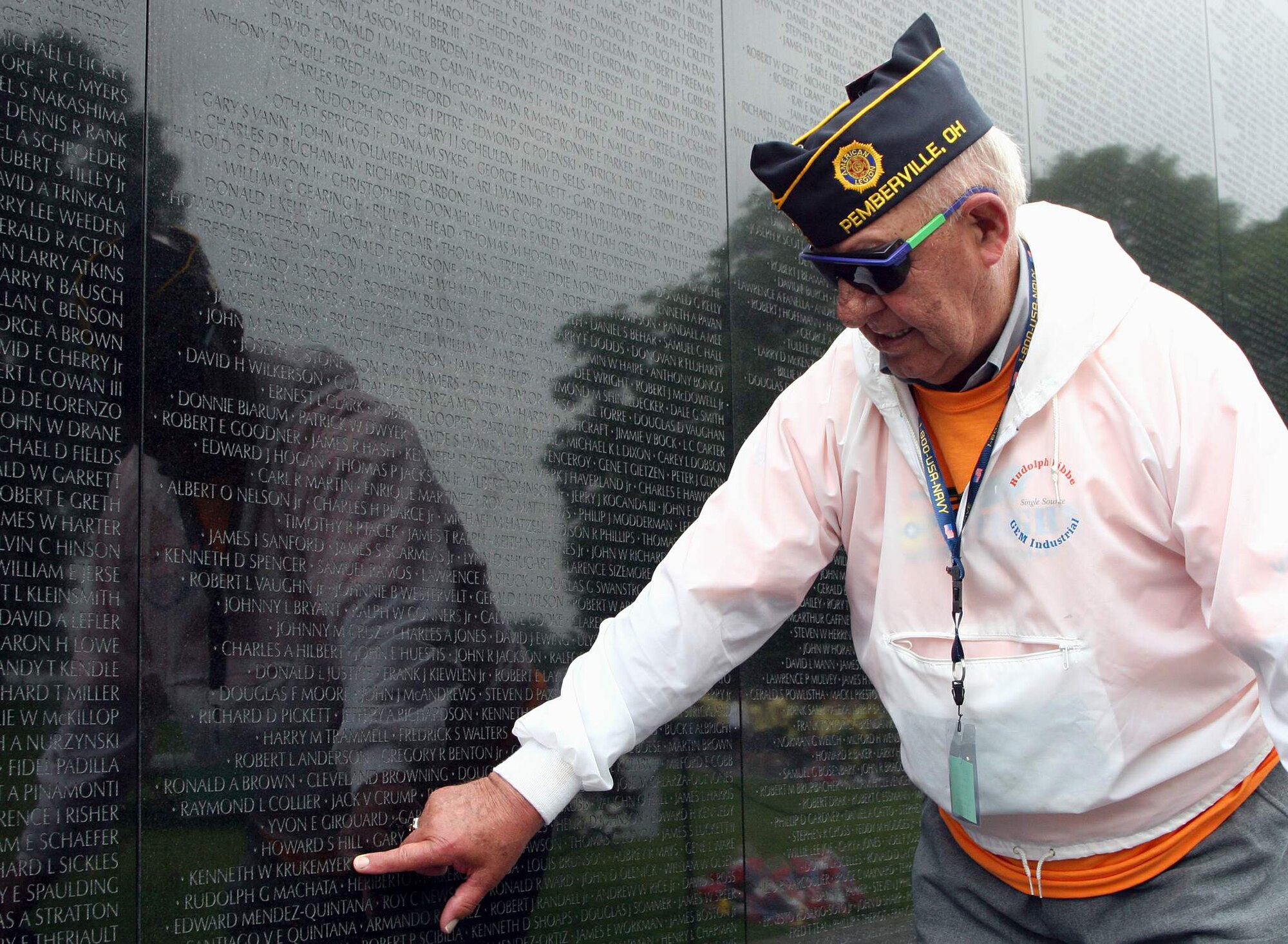 Douglas Wegman stops at the Vietnam Veterans Memorial to point out the name of a friend, Kenneth W. Krukemyer, who died during the conflict May 27 in Washington, D.C. Mr. Wegman is a veteran of World War II and the Korean War who made the trip to see the veterans' memorials as part of Honor Flight Northwest Ohio. (U.S. Air Force photo/Tech. Sgt. Karen J. Tomasik) 
