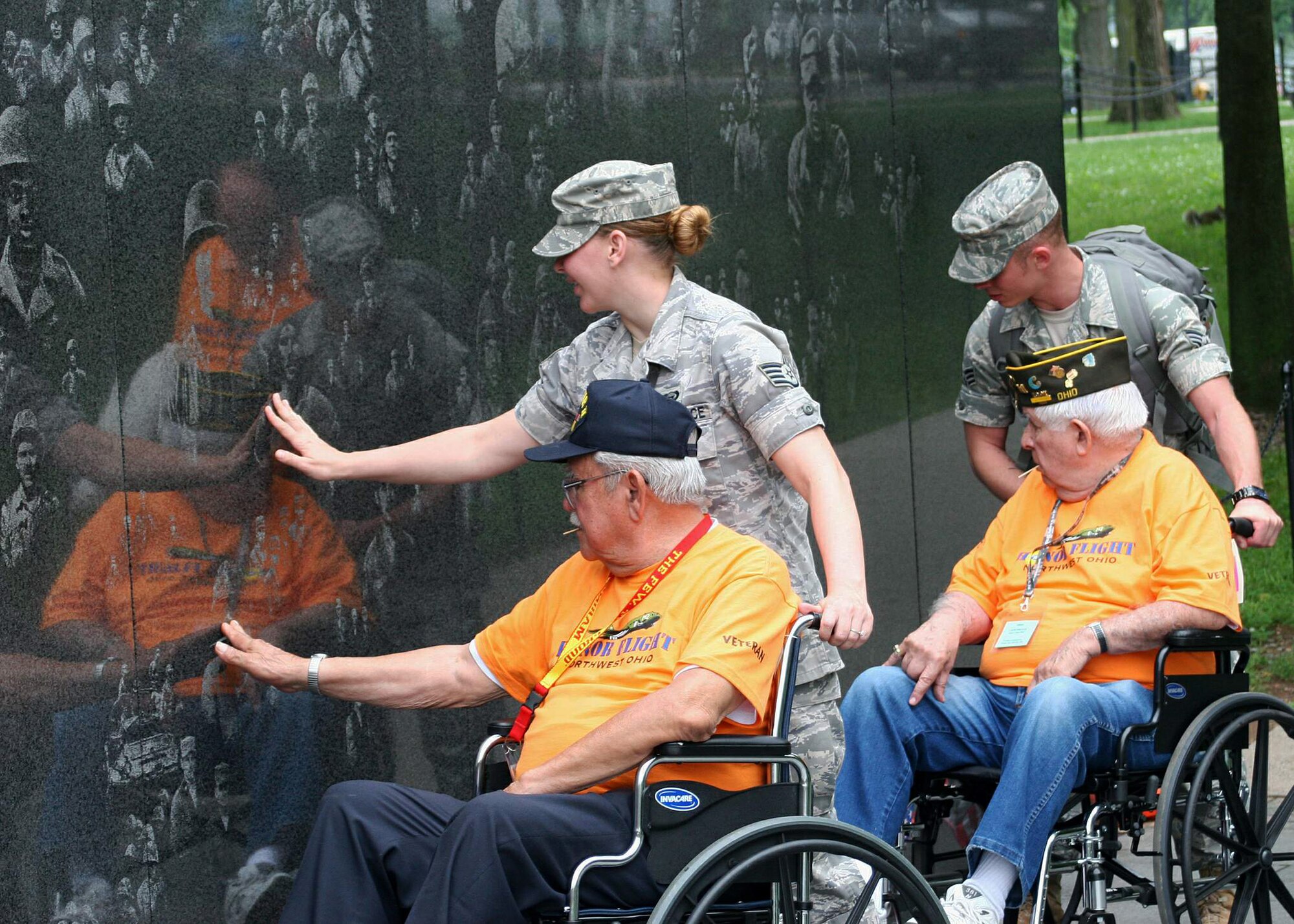 Airmen escort World War II veterans through the Korean War Veterans Memorial May 27 in Washington, D.C. The veterans traveled to Washington, D.C., as part of the Honor Flight program, which covers the entire cost of the veterans' travel to and from the memorial dedicated in their honor. The volunteers included active-duty and retired servicemembers from the 70th Intelligence Wing, the Defense Information School and various military intelligence battalions at Fort Meade, Md. (U.S. Air Force photo/Tech. Sgt. Karen J. Tomasik) 
