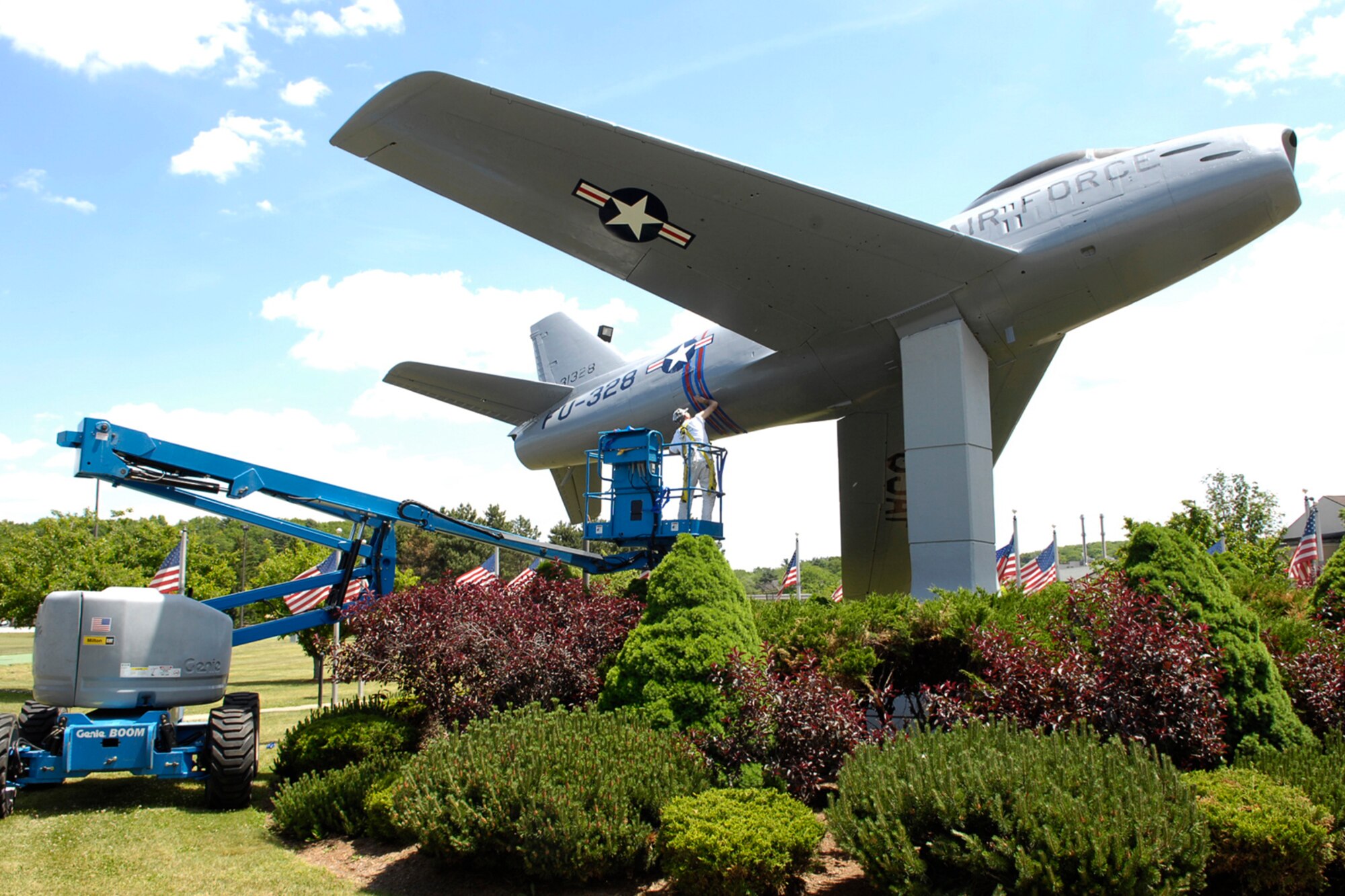 HANSCOM AIR FORCE BASE, Mass. –James Gouveia of R. J. McAuliffe Painting, Lowell, Mass., paints stripes on Hanscom’s F-86 Sabre static display on May 29. Both the F-86 and the P-40 displays are getting makeovers, complete with fresh coats of paint and some corrosion repair work to preserve the base’s heritage displays. (U.S. Air Force photo by Linda LaBonte Britt) 