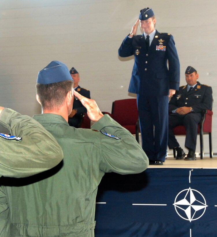Lt. Col. James Robinson, incoming 88th Fighter Training Squadron commander, renders his first salute to the members of the squadron during a ceremony June 4. 80th Operations Group Commander Axel Pohlmann officiated the event. The outgoing commander was German air force Lt. Col. Christian Rode. (U.S. Air Force photo/Harry Tonemah)