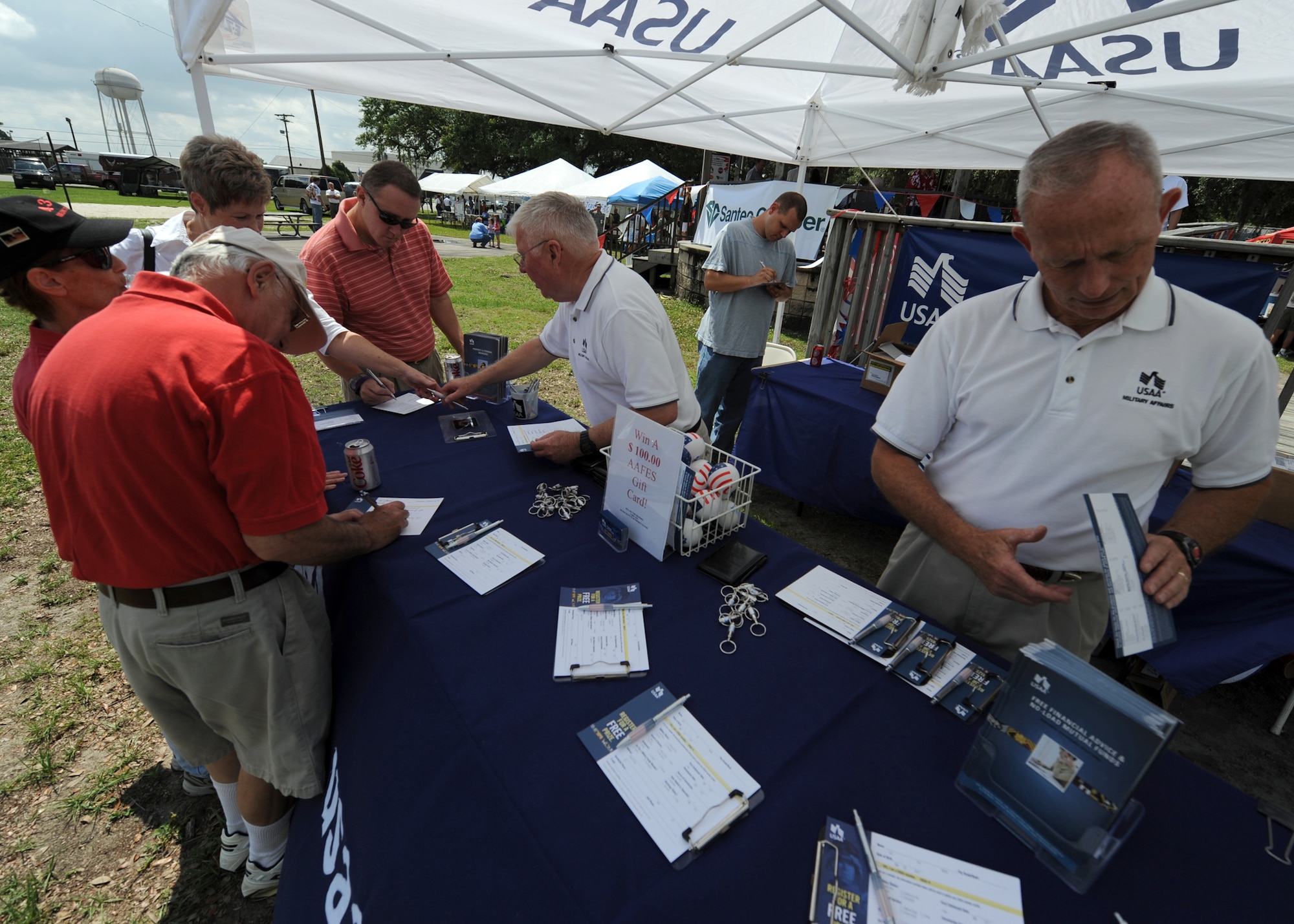Charleston community members sign up for gift cards at the United States Automobile Association booth during the Charleston AFB picnic here June 5. The picnic was the kickoff event for MatchUP, Air Mobility Command's summer program where players can win prizes by participating in base activities. (U.S. Air Force photo/Senior Airman Timothy Taylor)

