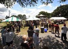 Airmen and members from the Charleston community stand in line as Airmen from the 437th Force Support Squadron serve food at the picnic grounds for the Charleston AFB picnic June 5. Families were able to register for MatchUP at the picnic for a chance to win valuable prizes and up to $10,000 cash. (U.S. Air Force photo/Senior Airman Timothy Taylor)