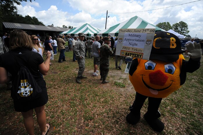 Workers from the Charleston Battery professional soccer team hand out tickets at Charleston AFB June 5, to Airmen and their families for the team's military appreciation night June 25 at Blackbaud Stadium on Daniel Island. (U.S. Air Force photo/Senior Airman Timothy Taylor)