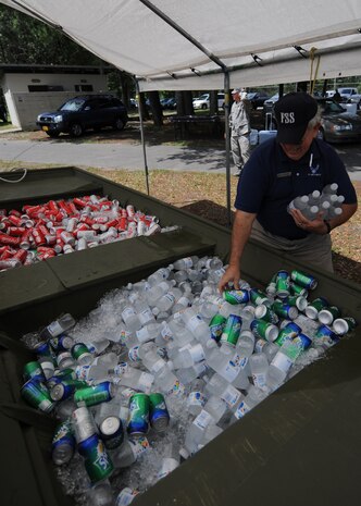 Ed Kinlaw stocks the refreshment boat at the Charleston AFB picnic June 5. The picnic was the kickoff event for Air Mobility Command's summer MatchUP program, where players can win prizes by participating in base activities. Mr. Kinlaw is a fitness assistant with the 437th Force Support Squadron. (U.S. Air Force photo/Senior Airman Timothy Taylor)