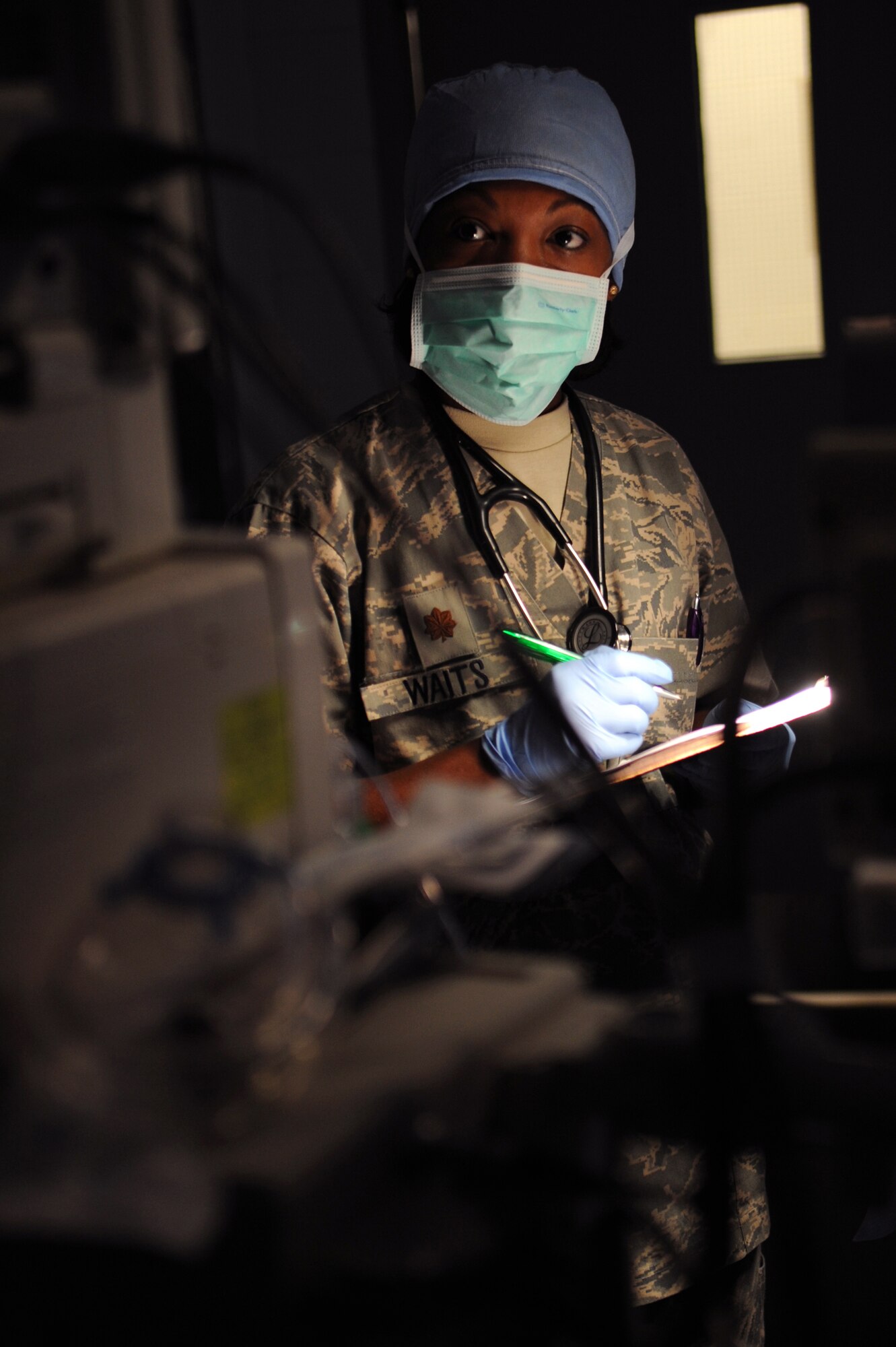 Major Alicia Waits, 379th Expeditionary Medical Group anesthesiologist, monitors the patient's vital signs and level of anesthesia during an operation for an inguinal hernia, June 5, 2009, at an undisclosed location in Southwest Asia.  This specific surgery allows the patient to return to duty quicker and with less pain.  The surgeries performed here range from elective to acute emergencies.  The surgical team provides treatment for patients coming in from all over the U.S. Central Command's Area of Responsibility.  Major Waits hails from New Orleans, La. and is deployed from Lackland Air Force Base, Texas, in support of Operations Iraqi and Enduring Freedom and Combined Joint Task Force - Horn of Africa.  (U.S. Air Force photo/Senior Airman Andrew Satran/released)