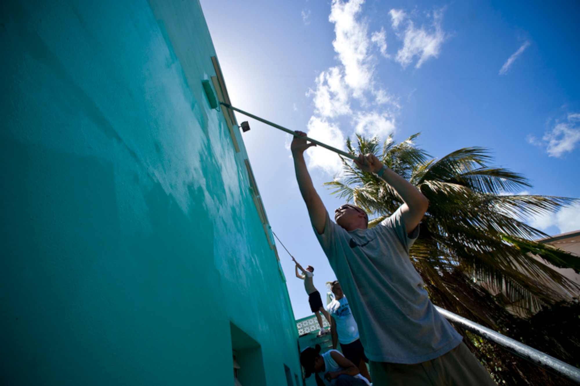 AirmEn of Operation Southern Partner spenD the day painting the 13-classrom exterior of the Stella Maris School for the Physically Disabled June 8 in Belize City, Belize. The operation is meant to enhance the spirit of cooperation between the two countries. (U.S. Air Force photo/Staff Sgt. Bennie J. Davis III)
