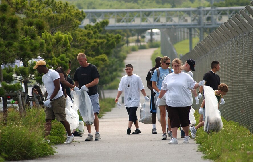 Kadena Airmen volunteer to pick up trash along the outside perimeter of Kadena Air Base between gate 3 and gate 1 June 6. Heroes of Planet Earth is a program inviting military personnel in an initiative to clean up, restore, and reclaim common outdoor venues used by guests of this host nation. (U.S. Air Force photo/Tech. Sgt. Rey Ramon)    