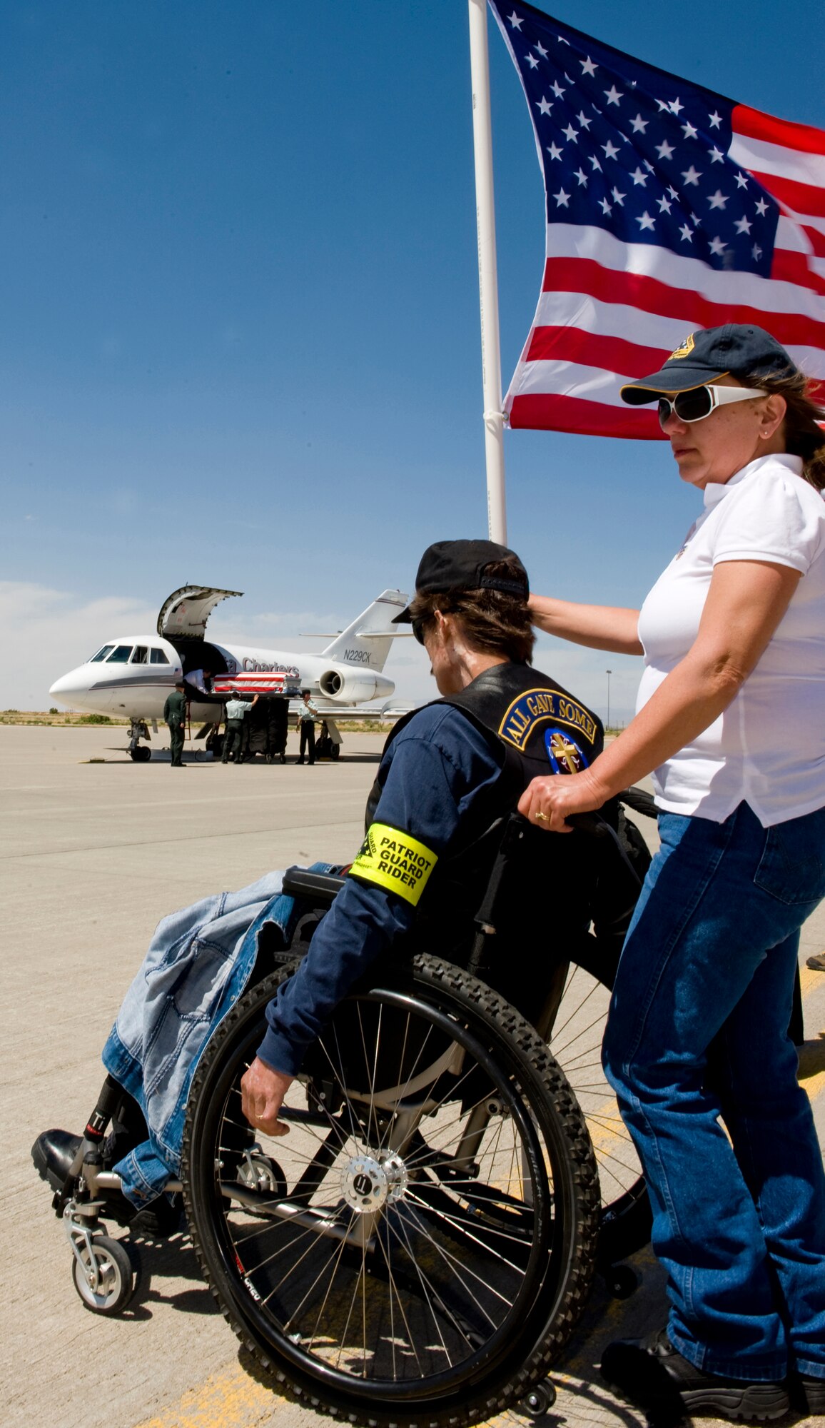 A member of the Patriot Guard Riders pays his final respects June 11 as the caisson of fallen Army Spec. Christopher M. Kurth arrives at Holloman Air Force Base, N.M. The Soldier was killed in a grenade attack near Kirkuk, Iraq, June 4. Specialist Kurth was a native of Alamogordo, N.M., and was stationed at Fort Hood, Texas. (U.S. Air Force photo/Tech. Sgt. Alan Port)