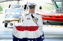 New MSST Miami (91114) commander Lt. Cmdr. Bryan E. Clampitt addresses hundreds of Sailors, Airmen, Soldiers and civilians during a change of command ceremony held at the U.S. Customs and Border Protection facility located on Homestead Air Reserve Base on June 11. (U.S. Air Force photo/Tim Norton)