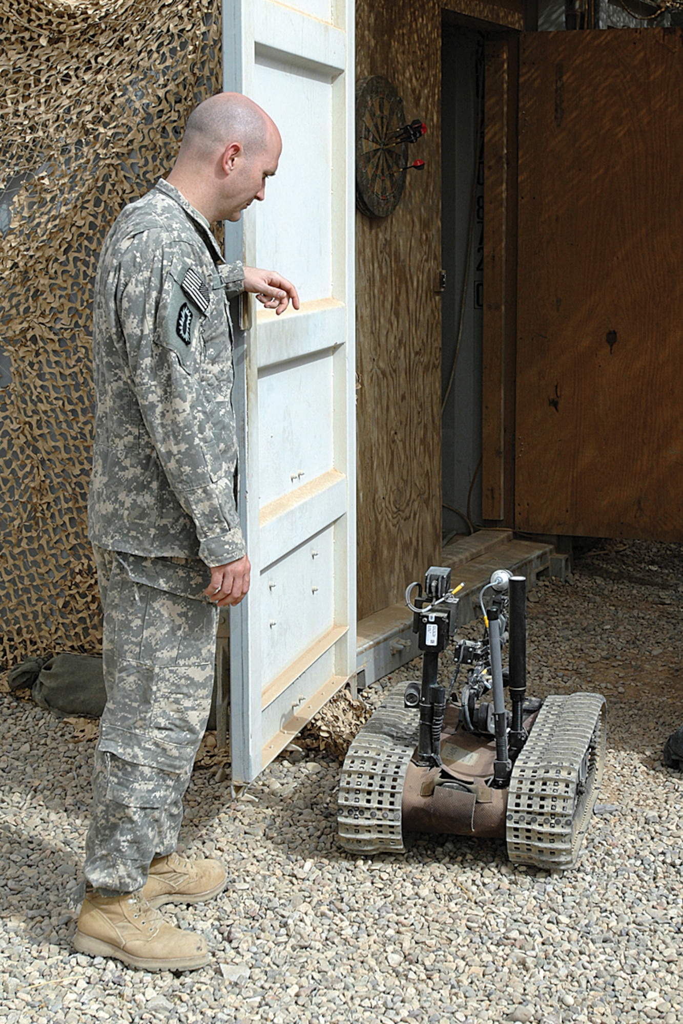 Tech. Sgt. Stephen Ray Hunter Jr., then assigned to the 506th Air Expeditionary Group Explosive Ordnance Disposal Flight as team leader, follows a TALON robot during a function check Sept. 14, 2008. The robot is used to recon and disable roadside bombs. He was deployed from the 944th Fighter Wing here. (U.S. Air Force photo/ Tech. Sgt. Jeff Walston)