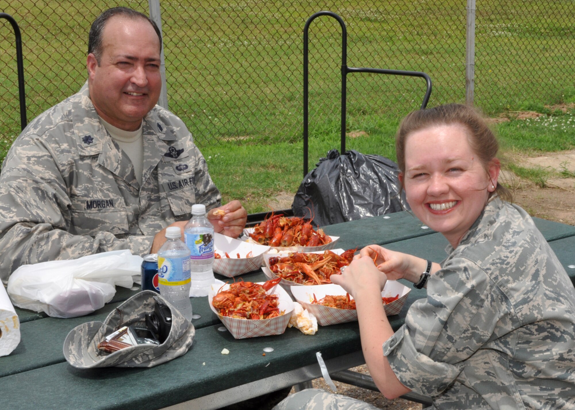 Lt. Col. Charlie Morgan, 917th Wing, process manager, and Capt. Stephanie Kennedy, 917 Wing, executive officer, crack and peel and nibble away, during a crawfish luncheon for 917th Wing Airmen at Barksdale Air Force Base, La., June 10, 2009. The luncheon was sponsored by Mr. Parker and the Shreveport Rubber and Gasket Company in “appreciation for what Barksdale Air Force Base does for the freedom we enjoy.” (U.S. Air Force photo/Tech. Sgt. Jeff Walston)