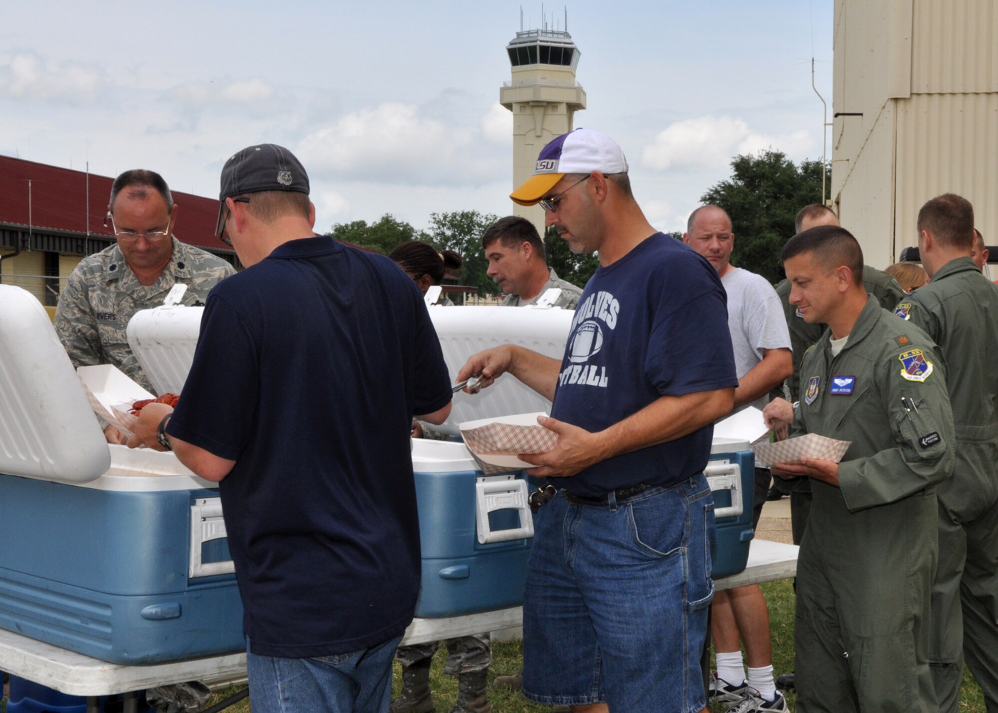 Airmen from the 917th Wing at Barksdale Air Force Base, La., have no problem forming up at the self-service serving line at a crawfish luncheon for Airmen of the 917th Wing at Barksdale Air Force Base, La., June 10, 2009. The luncheon was sponsored by Mr. Parker and the Shreveport Rubber and Gasket Company in “appreciation for what Barksdale Air Force Base does for the freedom we enjoy.” (U.S. Air Force photo/Tech. Sgt. Jeff Walston)