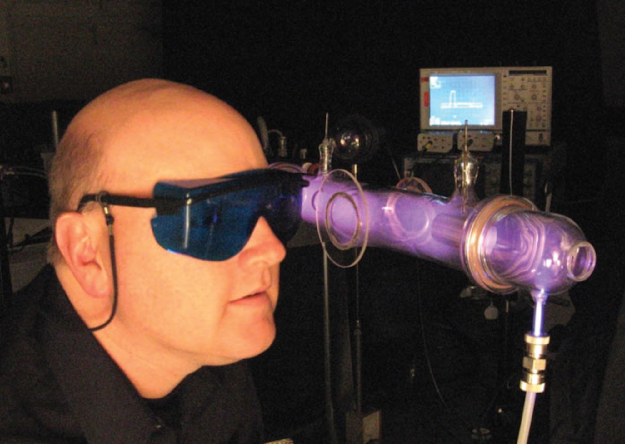 AFRL researcher uses an in-house optimized spectral analysis tool that leverages simple optical emission measurements to yield information on energetic metastable atom concentrations in an ionized gas (AFRL image).