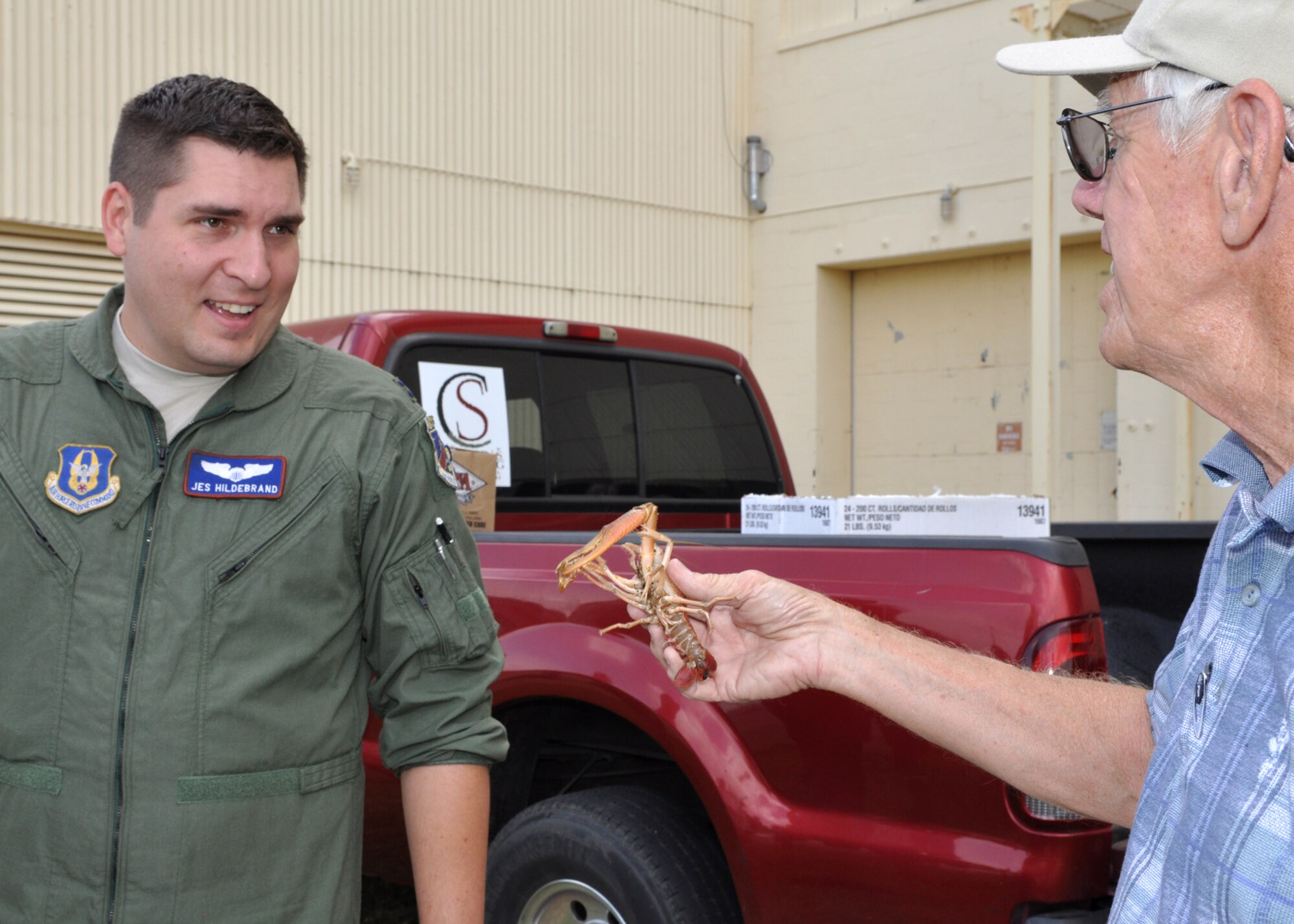 “Go ahead – touch it. It won’t hurt cha.” The saying takes on a whole new meaning as Boyd parker, general manager, Shreveport Rubber and Gasket Company explains the inner workings of “crawdad” psychology to Capt. Jesse A. Hildebrand, 93rd Bomb Squadron, B-52 instructor aircraft commander, during a crawfish luncheon for Airmen of the 917th Wing at Barksdale Air Force Base, La., June 10, 2009. The luncheon was sponsored by Mr. Parker and the Shreveport Rubber and Gasket Company in “appreciation for what Barksdale Air Force Base does for the freedom we enjoy.” (U.S. Air Force photo/Tech. Sgt. Jeff Walston)