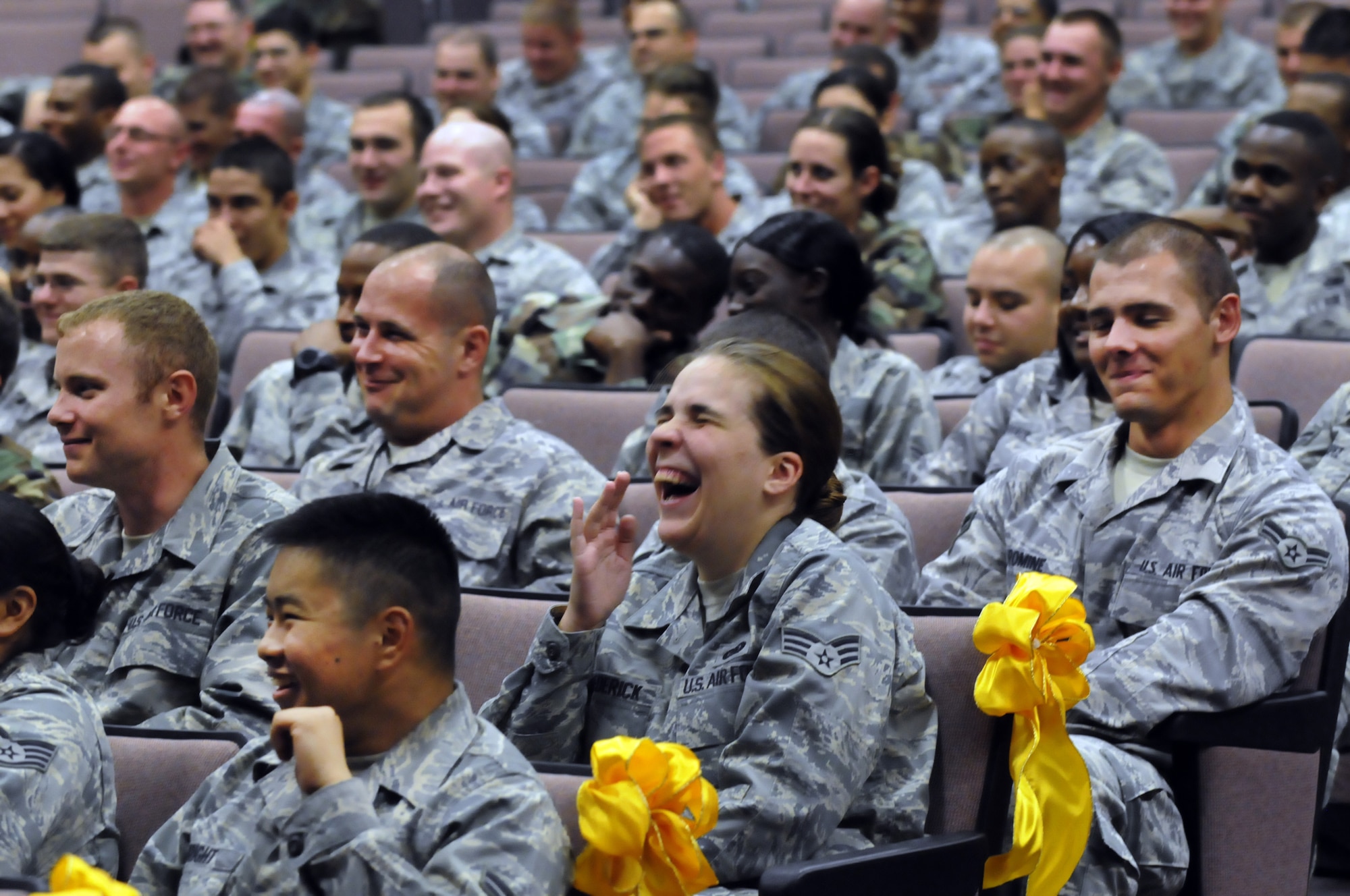 Robins airmen respond to Comedian Bernie McGrenahan during a Happy Hour Comedy Tour performance at the Robins Theater June 9. The show combines humor with an inspirational message. U. S. Air Force photo by Sue Sapp