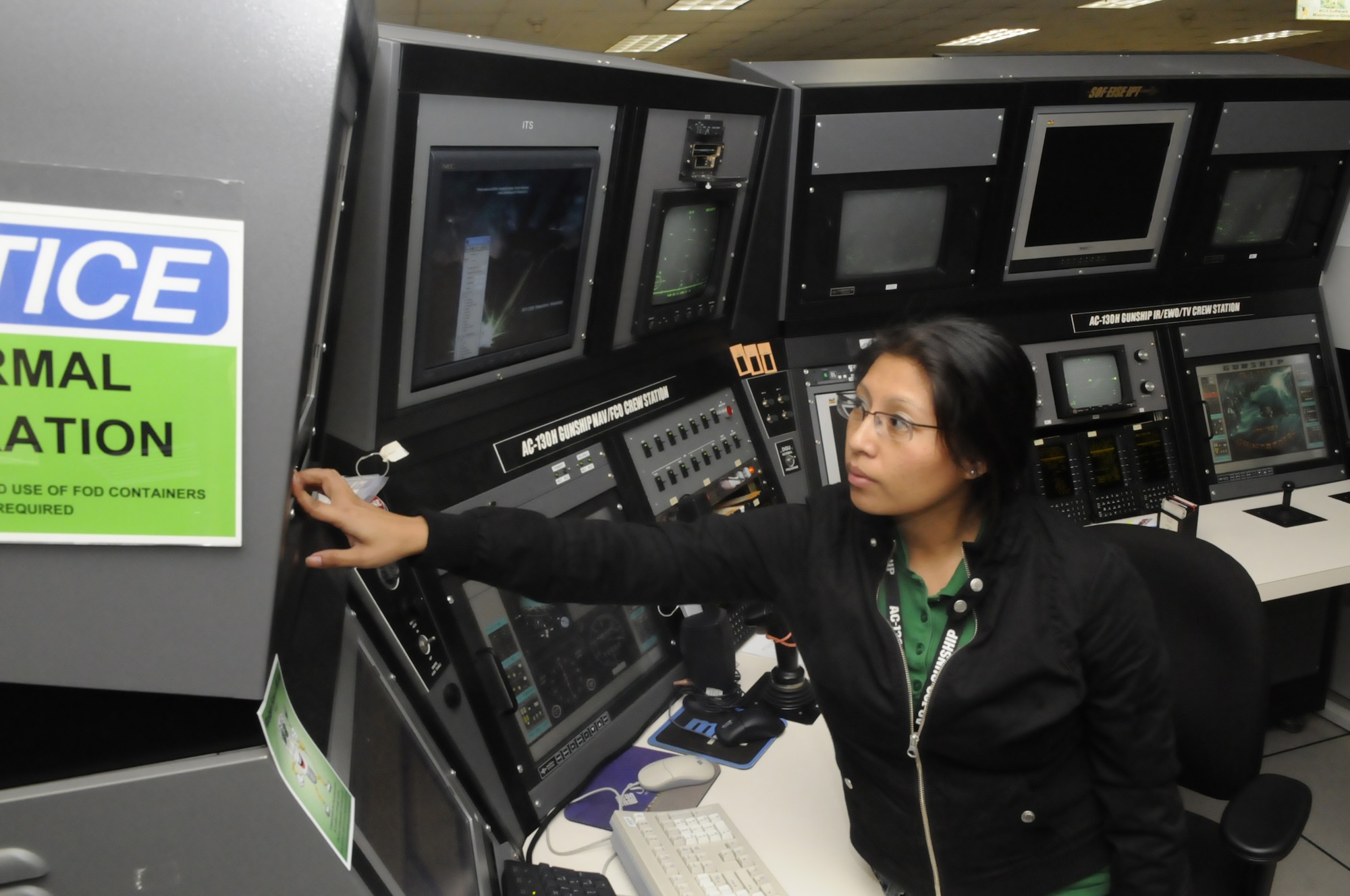 Carla Pati, flight test engineer, tests software at a C-130H Gunship crew station test bench. She is part of the 402nd Software Maintenance Group which is the first government organization on base to meet the requirements to become an OSHA Star Site. U. S. Air Force photo by Sue Sapp