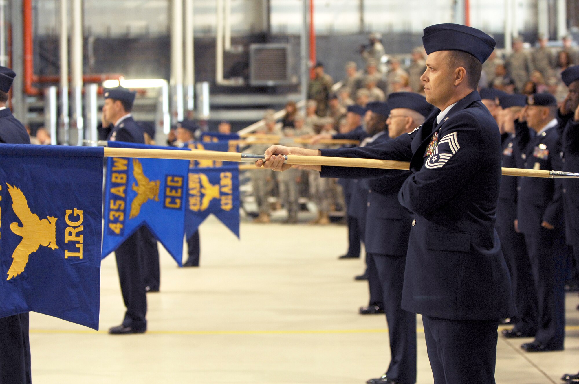 U.S. Air Force Airmen from the 435th Air Base Wing stand in formation during change of command ceremony in Hangar one, Ramstein Air Base, Germany, June 11, 2009. (U.S. Air Force photo by Senior Airman Amber Bressler)