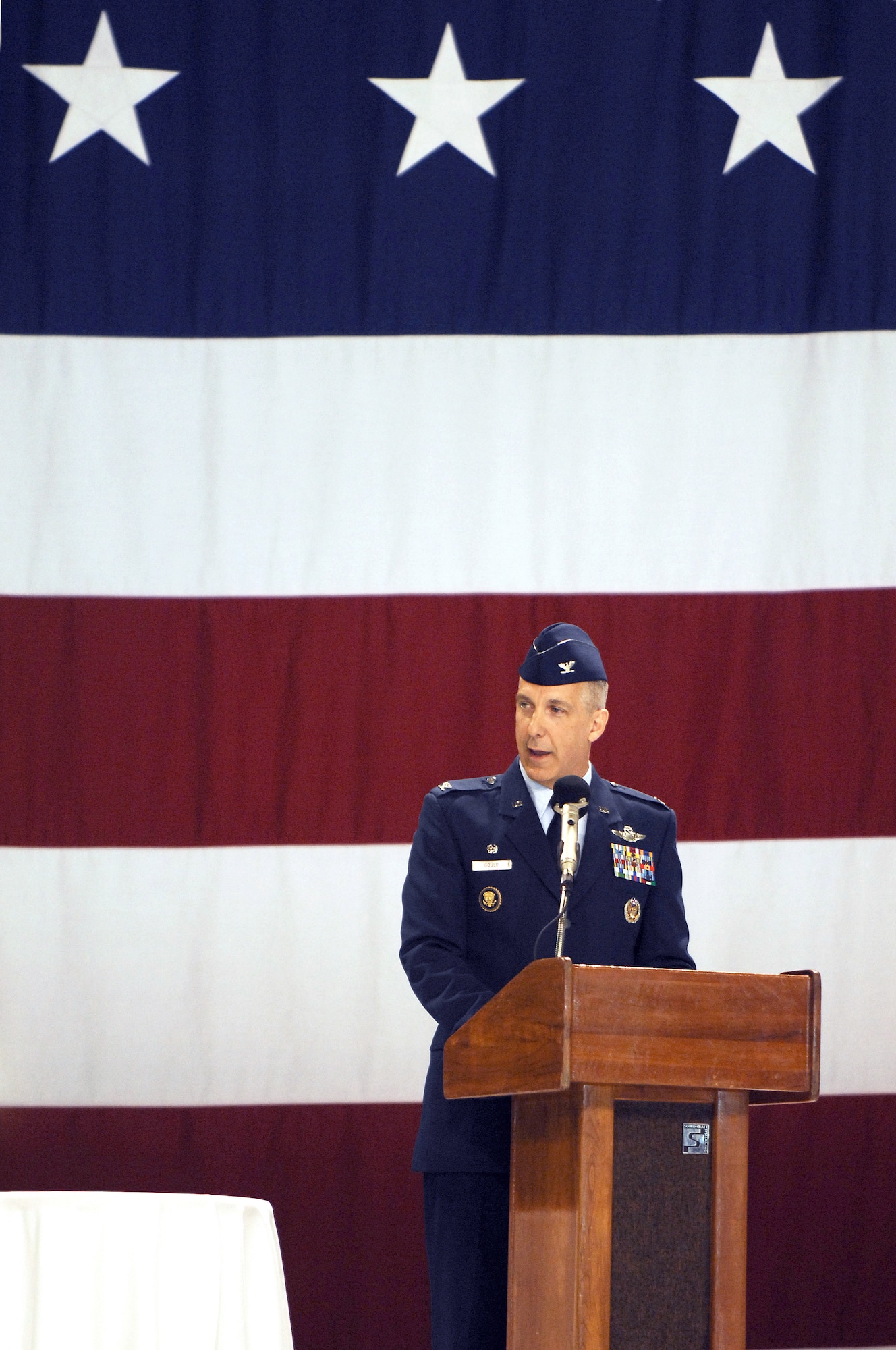 U.S. Air Force Col. Thomas F. Gould, 435th Air Base Wing commander, addresses the crowd during the 435th Air Base Wing Change of Command ceremony in Hangar one, Ramstein Air Base, Germany, June 11, 2009. (U.S. Air Force photo by Senior Airman Amber Bressler)

