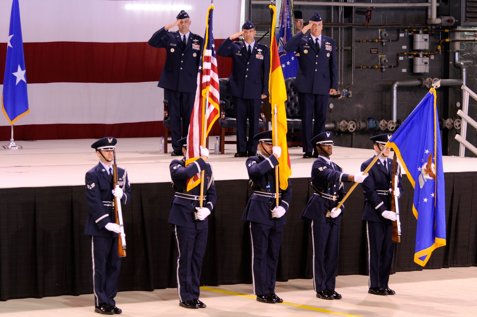 U.S. Air Force Maj. Gen. Mark R. Zamzow, 3rd Air Force vice commander, Col. Donald Bacon,  former 435th  Air Base Wing commander, newly appointed 435th  Air Base Wing, Col. Thomas F. Gould salutes during the posting of the colors, at the 435th Air Base Wing Change of Command ceremony, Ramstein Air Base, Germany, June 11, 2009. (U.S. Air Force photo by Tech. Sgt. Kenneth Bellard)