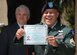 TEGUCIGALPA, Honduras - U.S. Army Staff Sgt. Damien Milne shows off his certificate of U.S. citizenship following his naturalization in a formal ceremony at the U.S. embassy here June 10.  Sergeant Milne is from the Marshall Islands.  He is a two-time Iraq war veteran and is currently assigned to Joint Task Force-Bravo's 1st Battalion, 228th Aviation Regiment.  His ceremony here was the first U.S. naturalization ceremony to take place in Central America.  (U.S. Air Force
photo/Tech. Sgt. Rebecca Danét)
