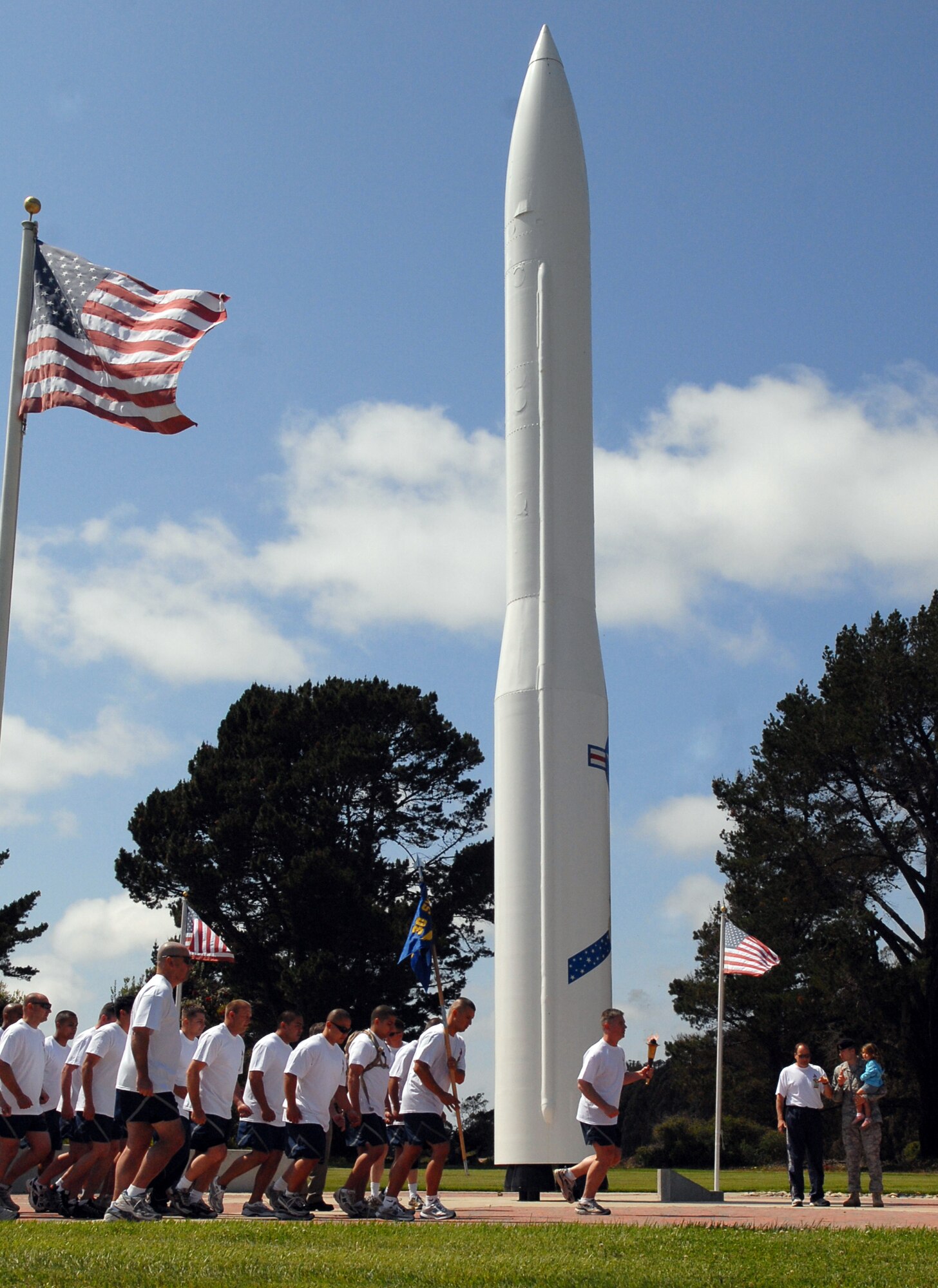 VANDENBERG AIR FORCE BASE, Calif. – Lt. Col. Joseph Milner, the 30th Security Forces Squadron commander, runs the Special Olympics torch as he leads Airmen from his squadron through the base's cantonment area here June 9. Vandenberg is just one leg of the county-spanning torch relay fundraiser performed by Santa Barbara County law enforcement agencies. (U.S. Air Force photo/1st Lt. Raymond Geoffroy)