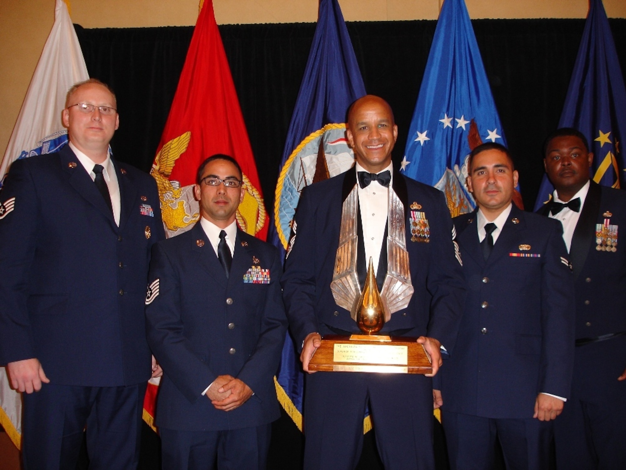 Members of the 60th Logistics Readienss Squadron are awarded The American Petroleum Institute's trophy for best fuels management flight in the Air Force. (U.S. Air Force photo)