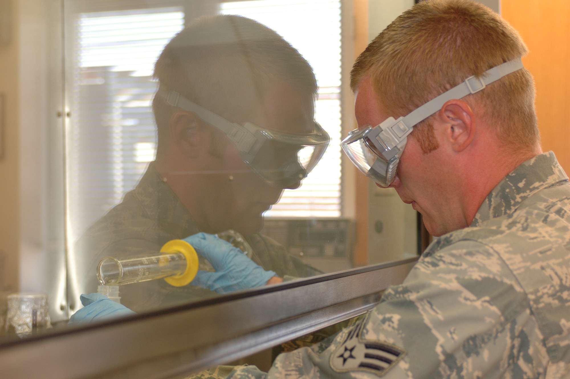 Senior Airman David Taylor runs a test in the fuels lab. The 60th Logisitics Readiness Squadron's fuels flight was recently named the best in the Air Force by the American Petroleum Institute. (U.S. Air Force photo/Nick DeCicco)